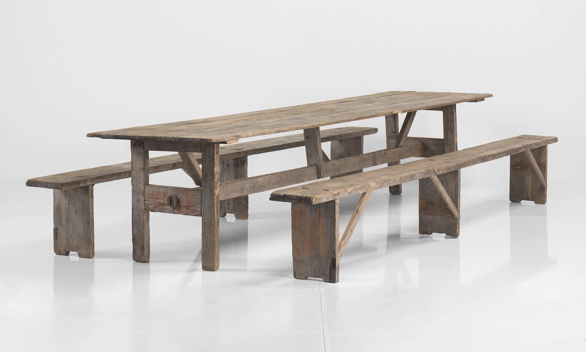Massive Dining Table with Benches, circa 1900.

Simple form with primitive construction and original benches.