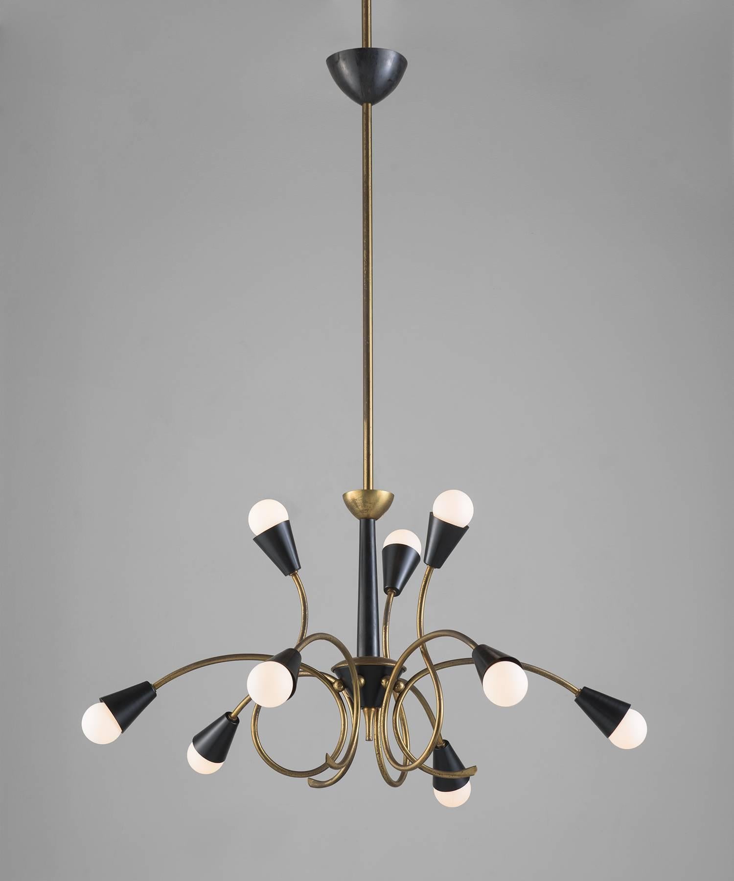 Brass and black metal modernist chandelier, circa 1960.

Nine globe Italian chandelier with alternating upward and downward looping arms.
 