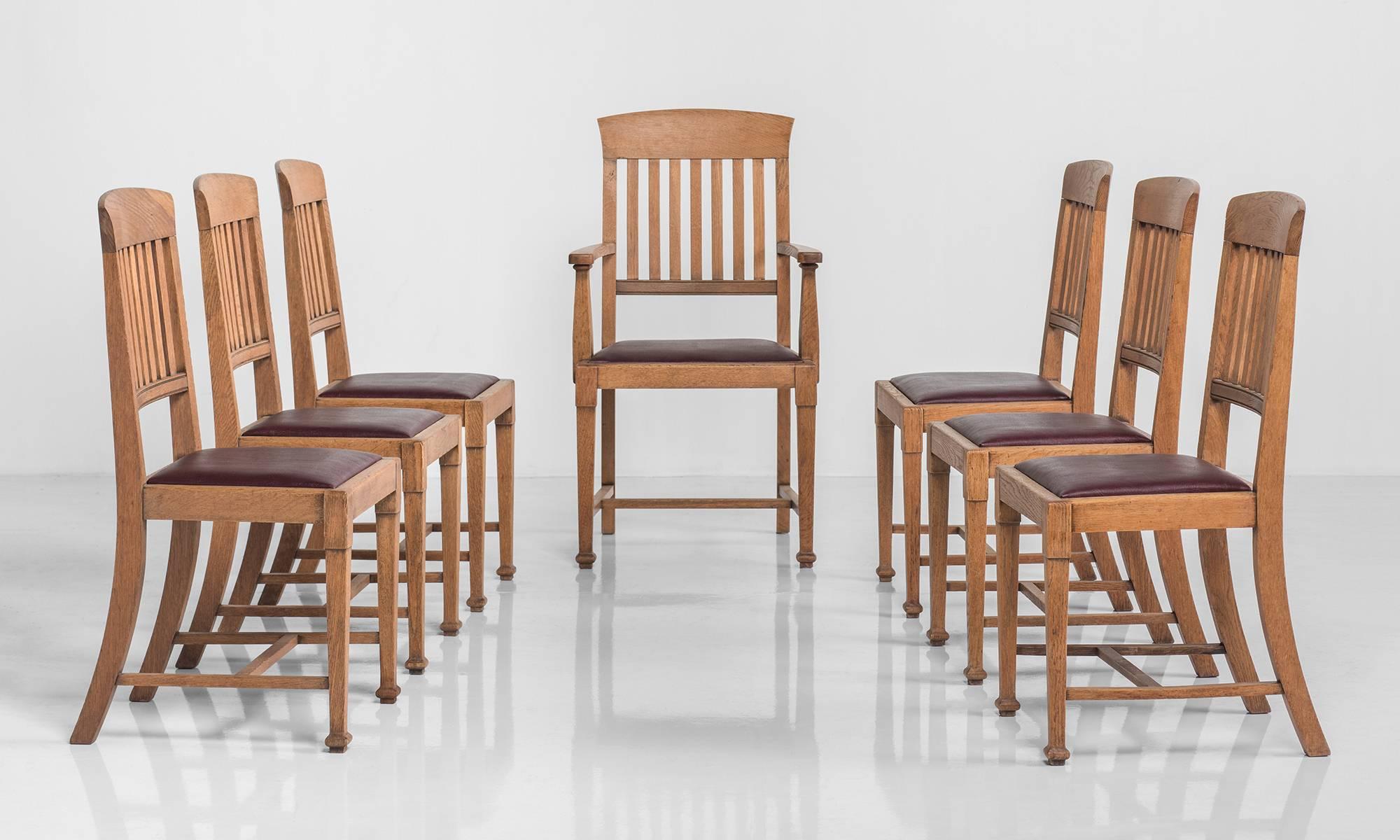 Set of eight oak dining chairs, circa 1900.

Solid oak, produced by Warings of London, six chairs and two armchairs. 