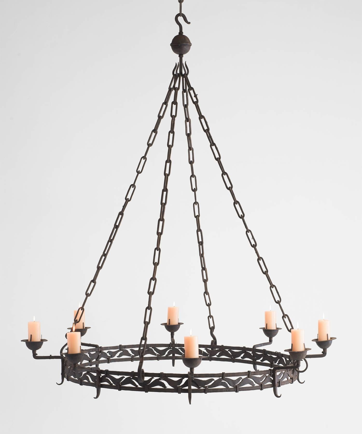 Massive Iron Candlelight Chandelier, circa 1900

Extremely large form holds (8) pillar candles with patterned ironwork around base. 

12.5