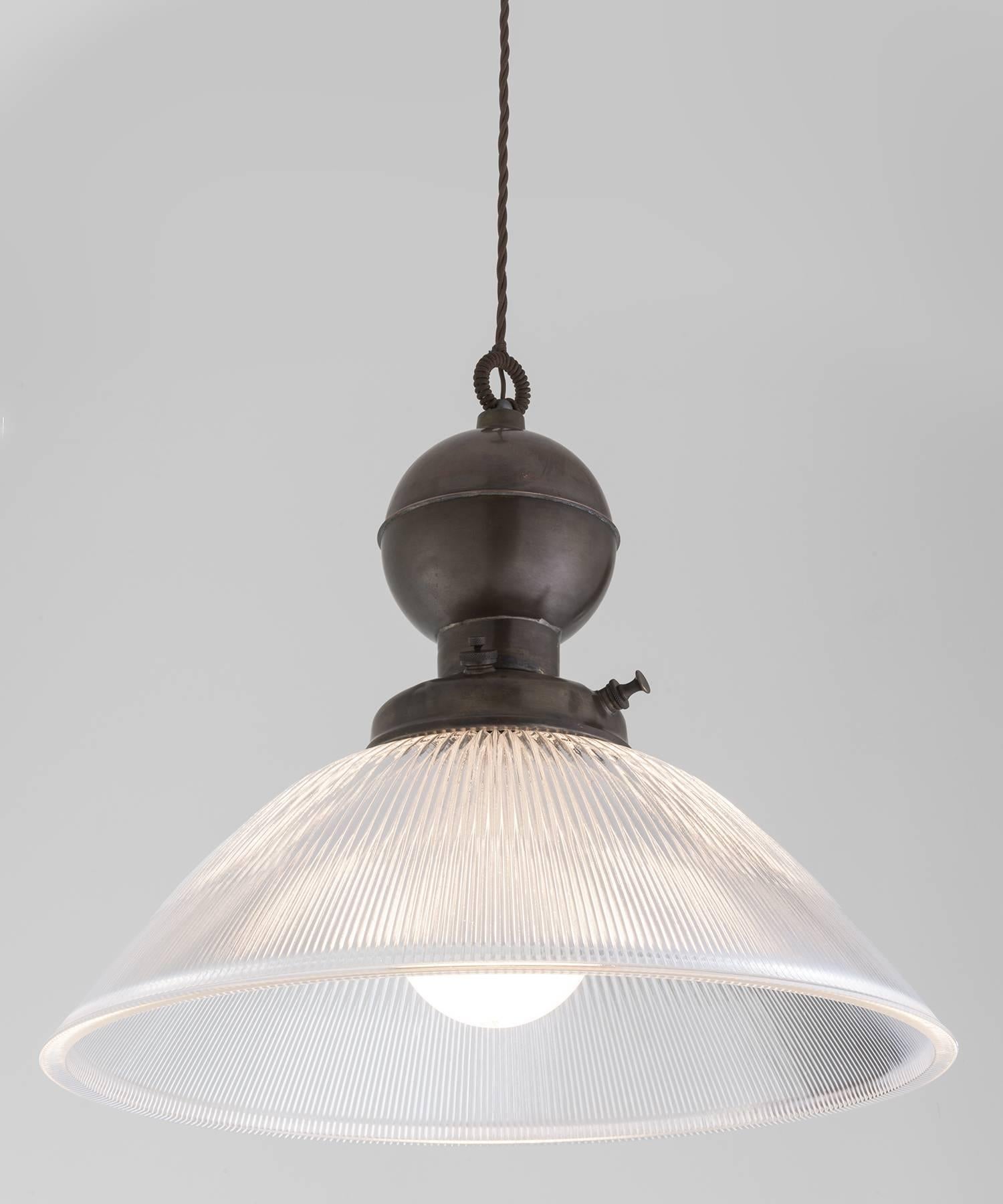 Industrial Glass and Brass Gas Lamp Pendant, Italy, 21st century

In the style of an industrial gas lamp pendant, converted to electric. 