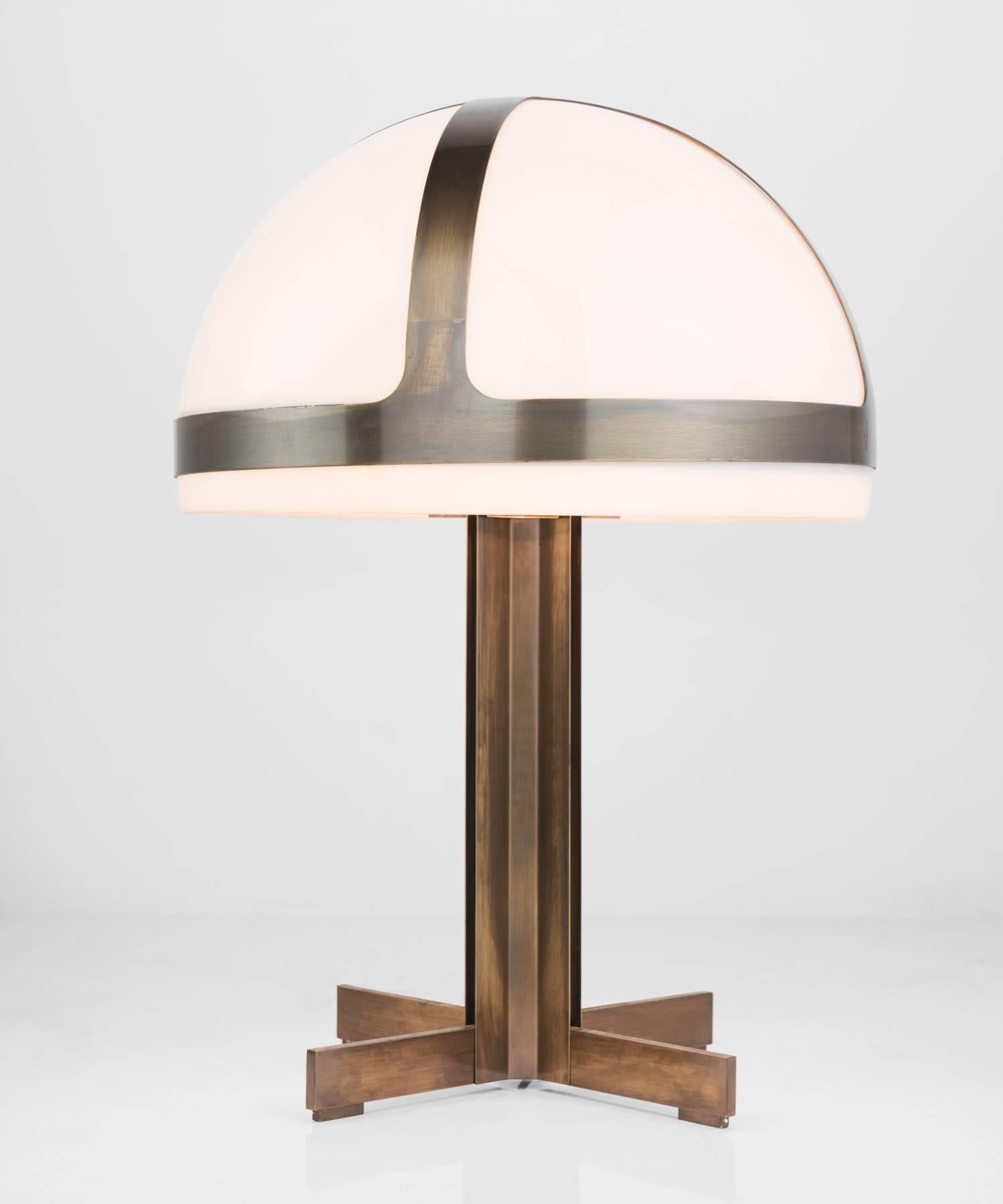 Bronze table lamp, circa 1970.

Large geometric form with bronze detailing around plexiglass shade. Fabricated by Brüll and Gruber, Munich.
