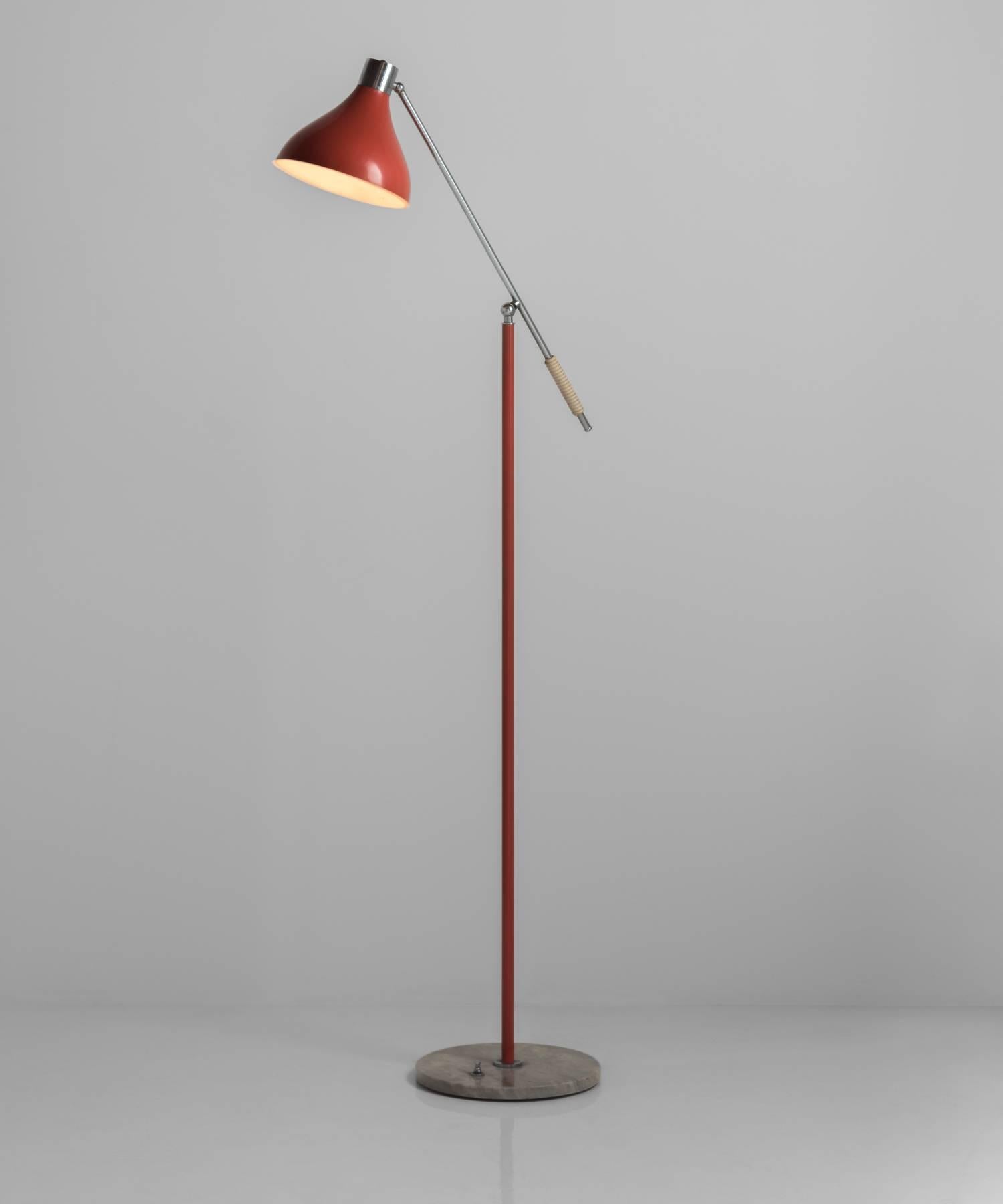 Red metal floor lamp with chrome hardware on marble base.

Designed by Stilux in Italy, circa 1960.