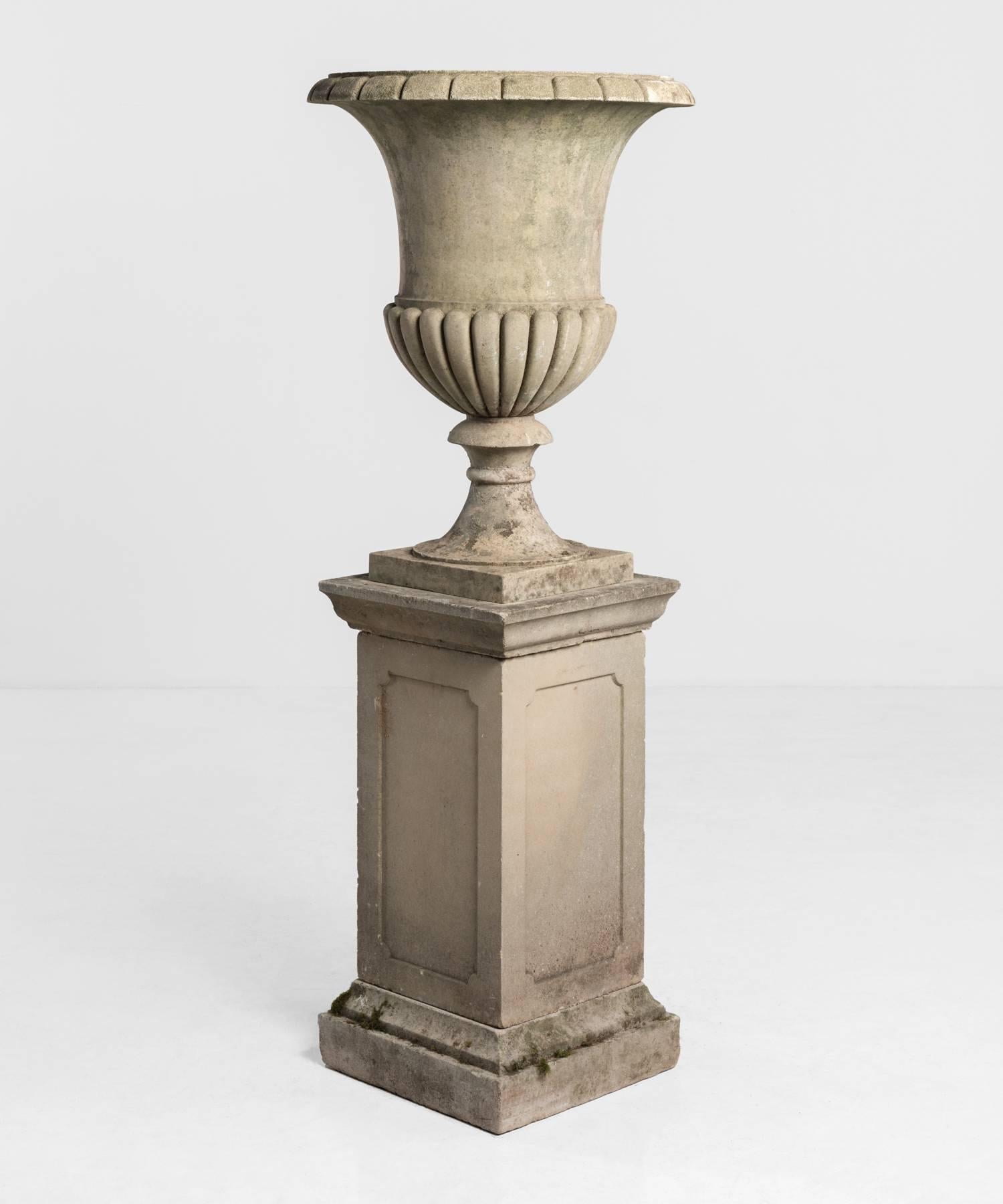 Large sandstone urn with pedestal, circa 1950.

Elegant form with original patina.