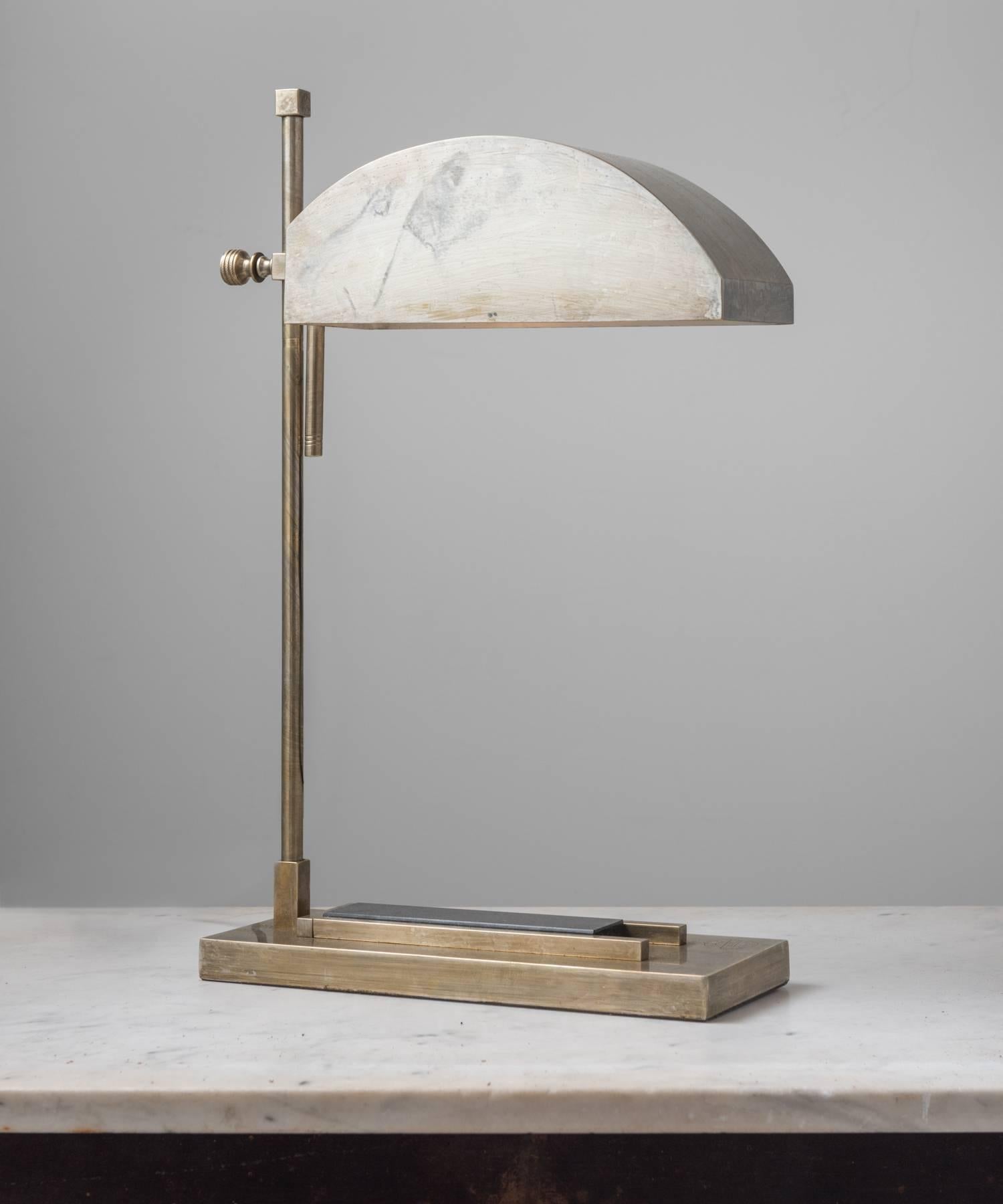 Marcel Breuer desk lamp, made in Germany, circa 1925.

Created for the International exposition of modern Industrial and decorative arts, in Paris; brass plated nickel and stamped “Exposition Paris, 1925”.

Adjustable height, with inset black