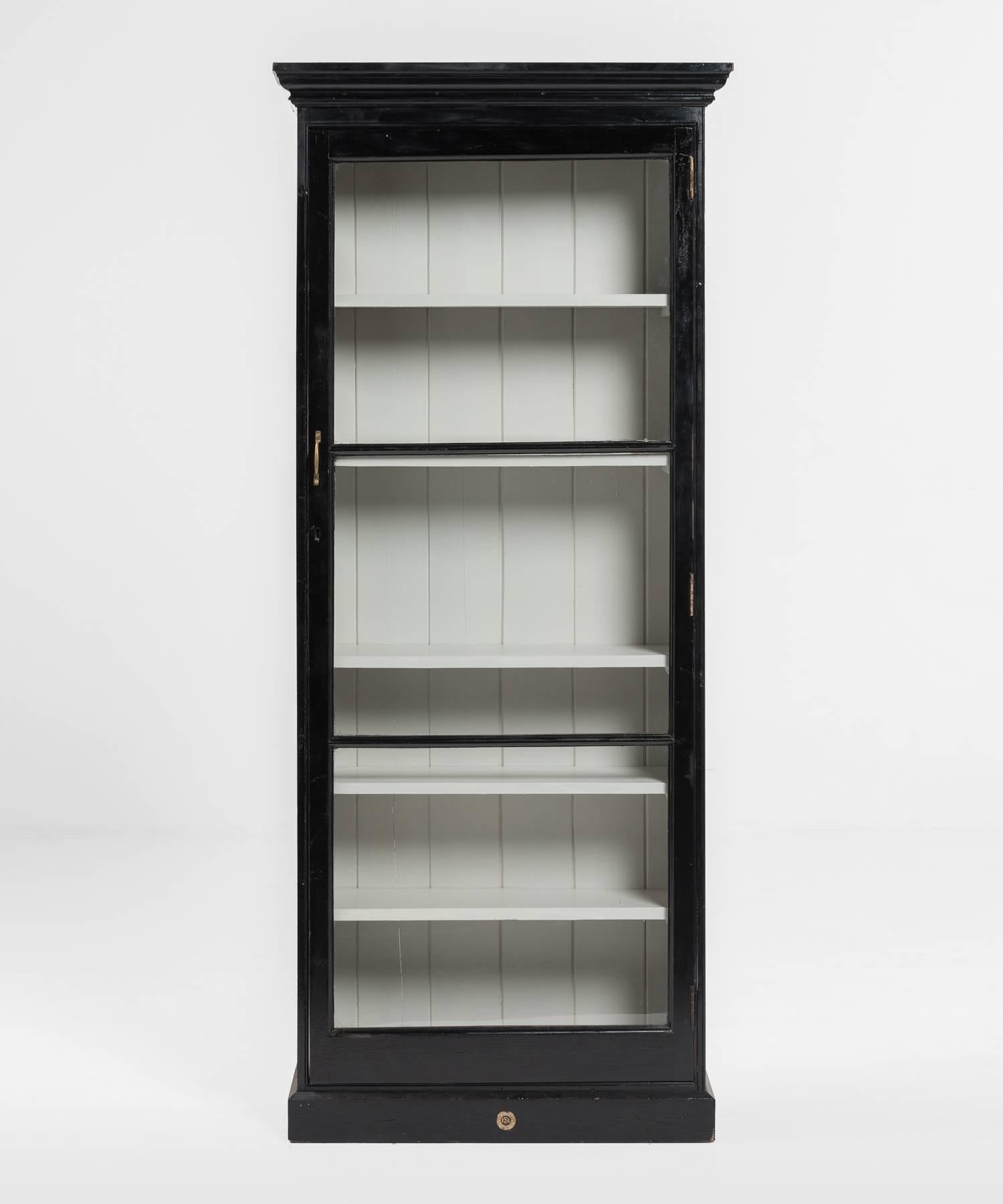 Edwardian Library Bookcase, circa 1910.

Ebonised pine case with adjustable shelves and original wavy glass. Cabinet is stamped with makers mark “ESA” from the Educational Supply Association.