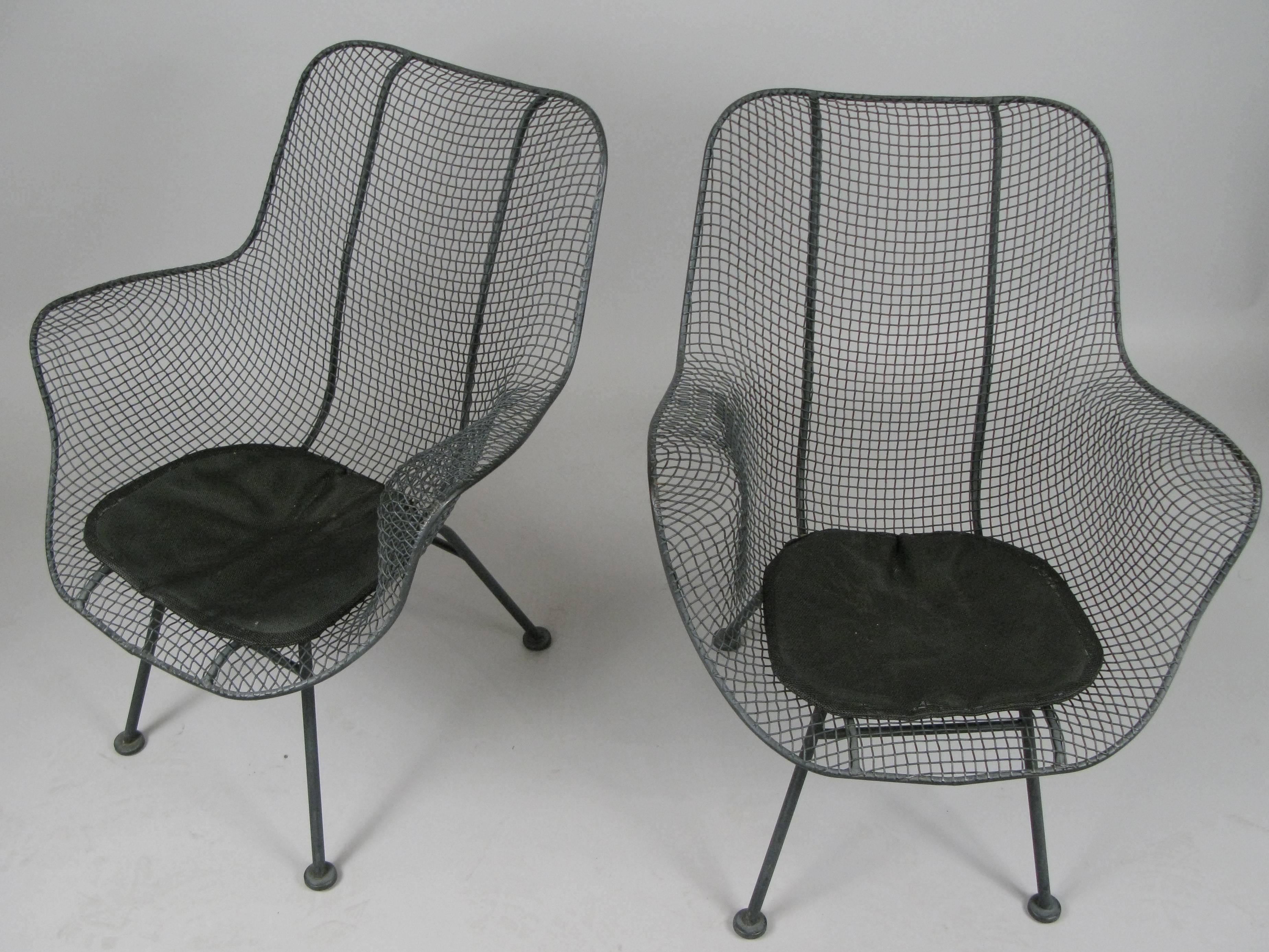 A vintage pair of high back vintage Woodard Sculptura armchairs, with the original dark grey finish in mint condition and the original seat pads as well. Comfortable and stylish, beautiful examples of these Classic chairs. We always have a variety