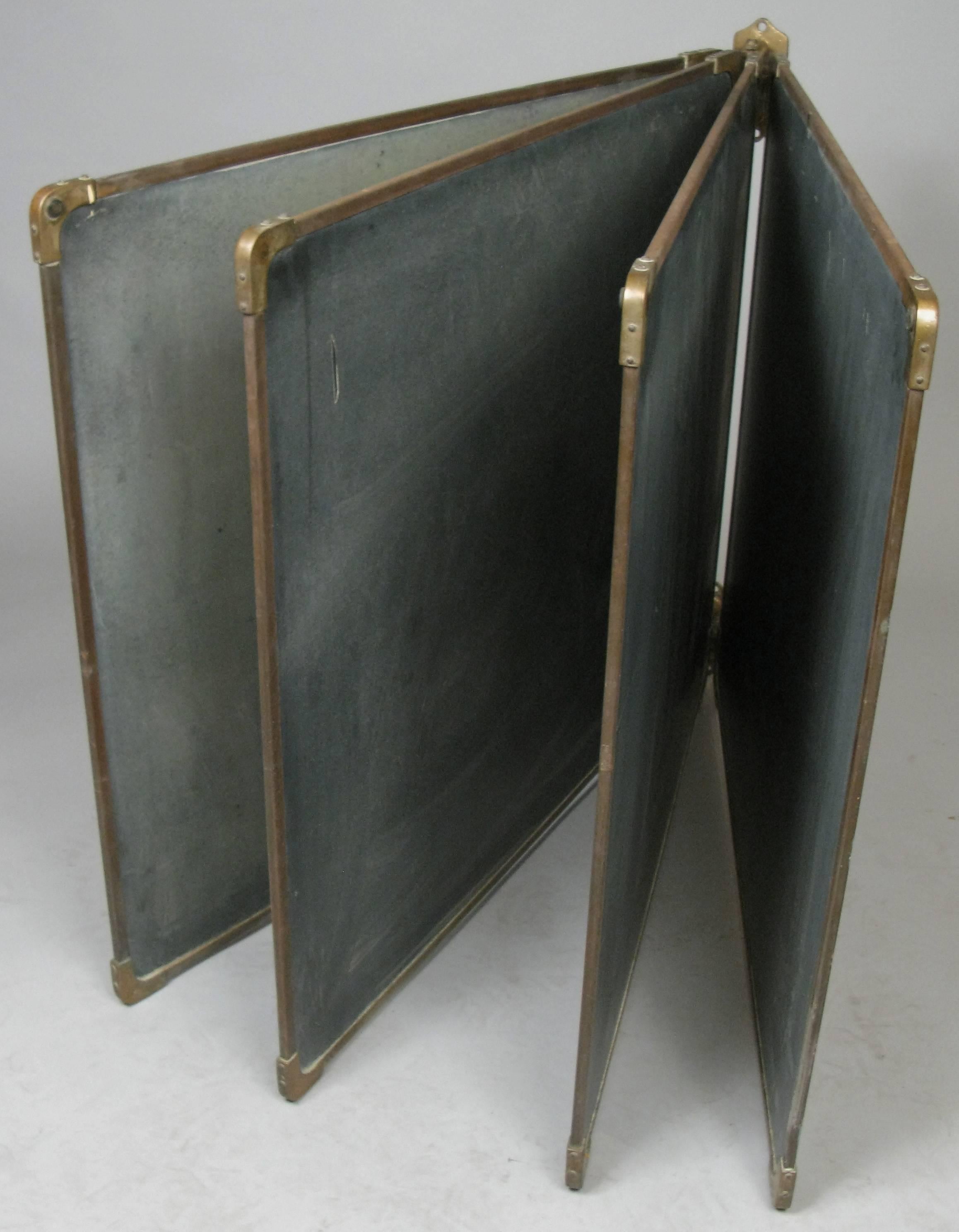 An outstanding set of antique slate chalkboards in their original frames with bronze corners, along with the bronze wall mounted brackets that hold them all and allow them to pivot to use both sides of the boards. Beautiful set in very good