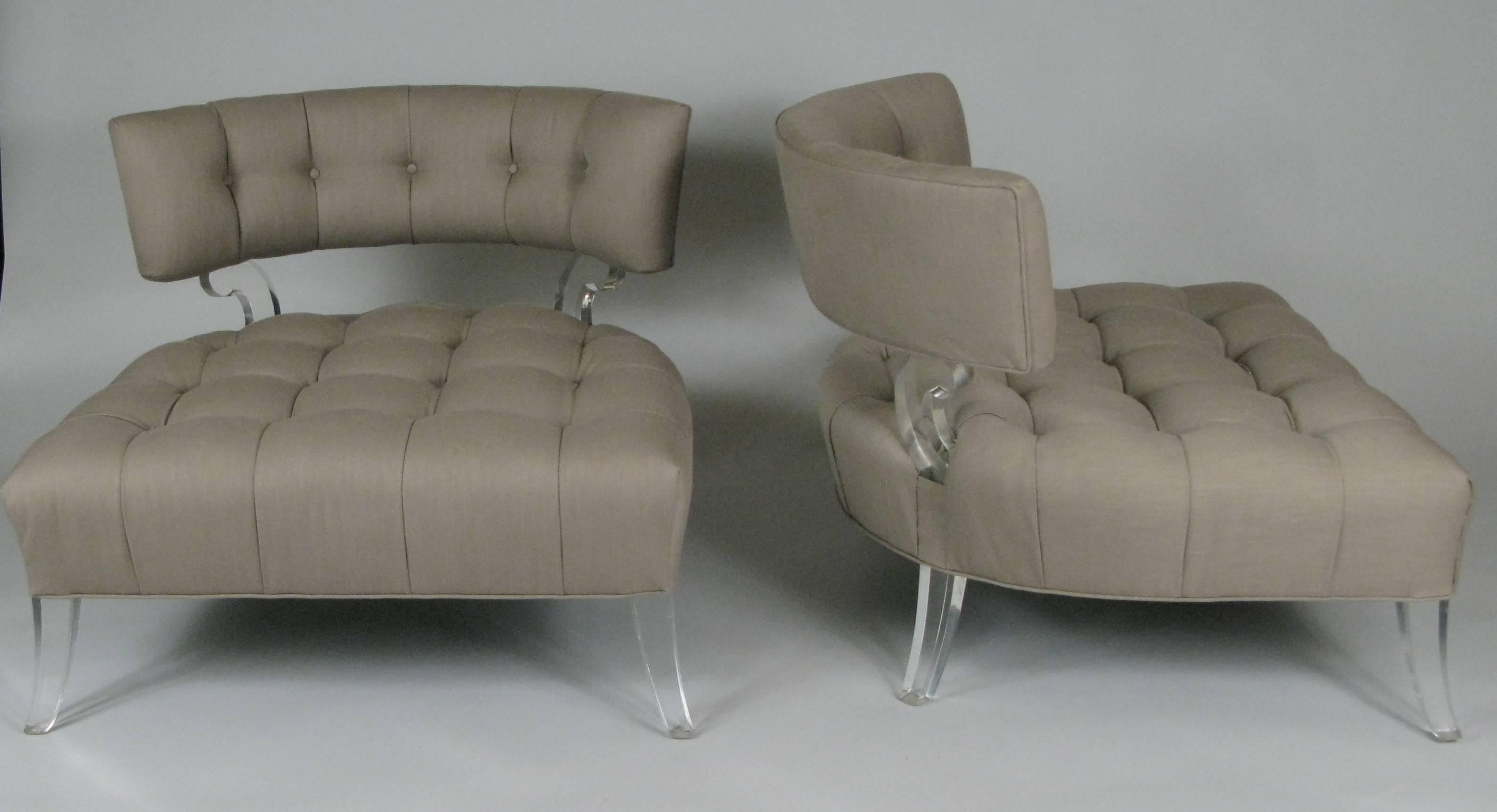 An extremely rare pair of 1940s slipper chairs with Lucite frames and deeply tufted seats and curved backs. These are one of the most iconic pieces from Lorin Jackson's 'Glassics' collection, which used the new Lucite material as an integral element