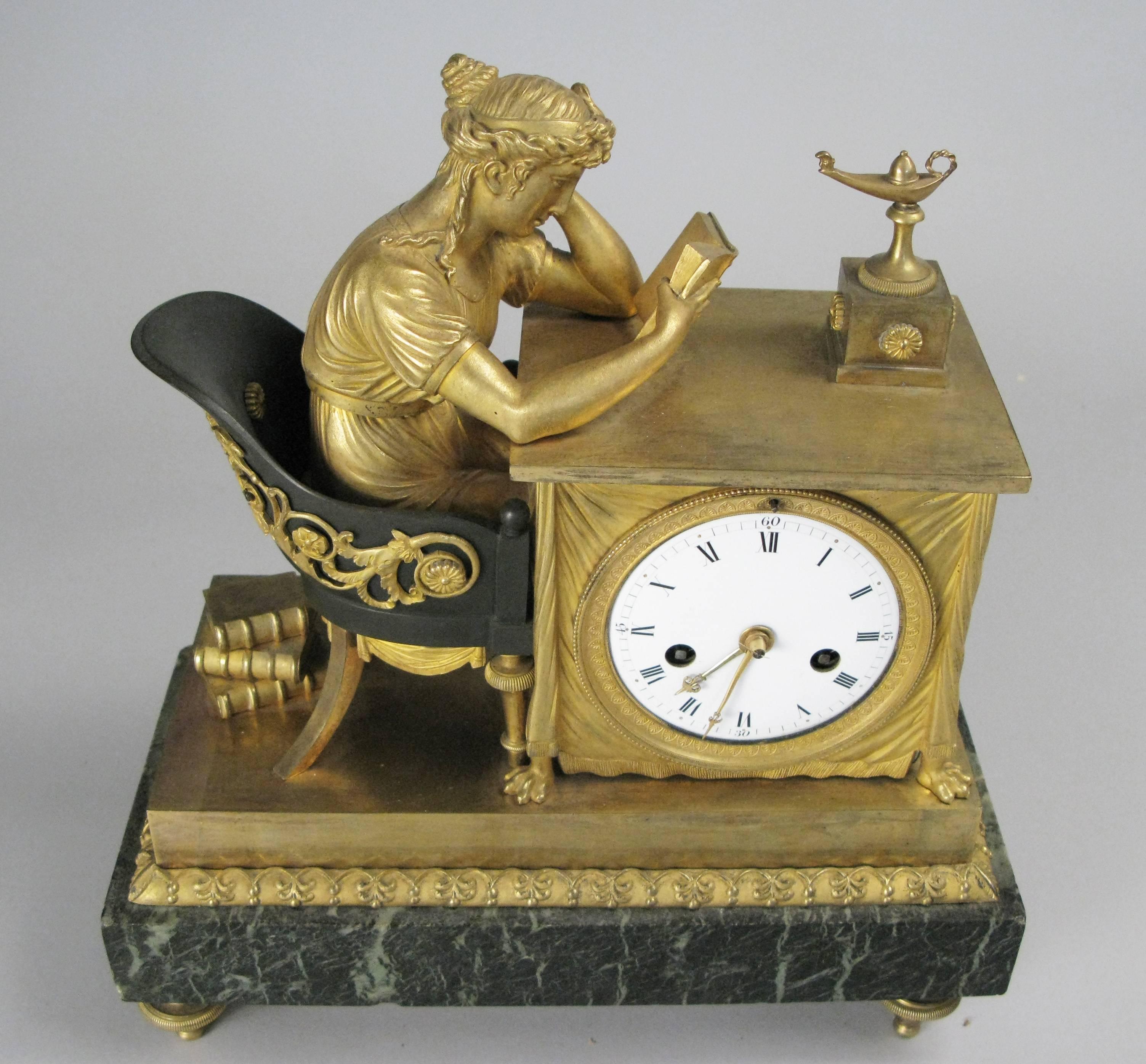 A very beautiful and elegant antique 1860s French empire mantel clock with a marble base and gilt bronze case, adorned with a classical female figure seated in an ormolu and bronze chair reading. Beautiful condition and fully working keeping perfect