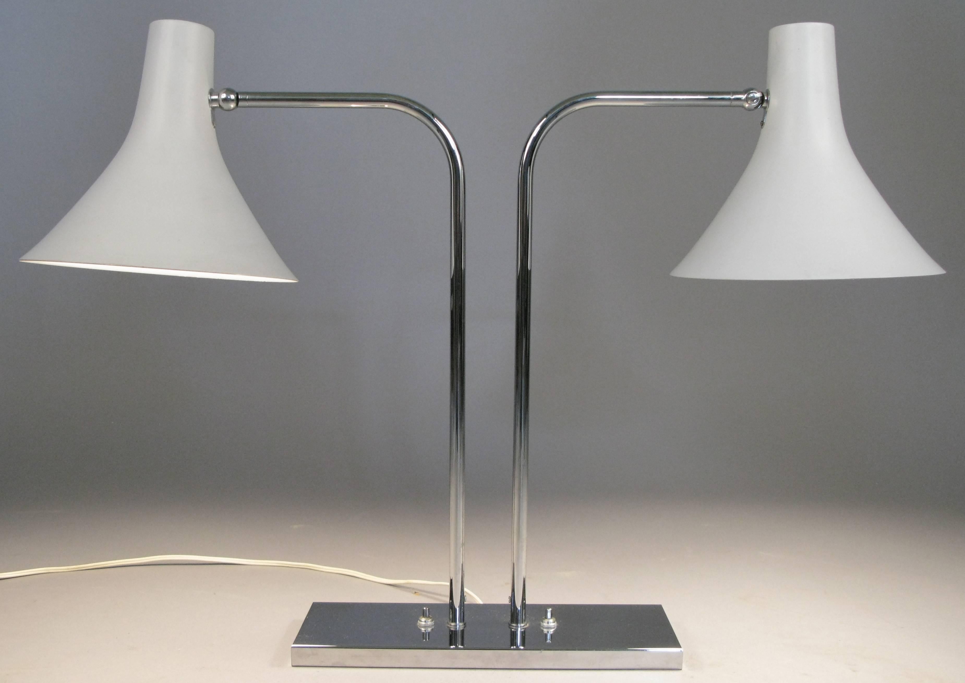 A very nice example of this versatile Mid-Century Modern table or desk lamp by Nessen. With a perfect chrome finish, each lamp is operated separately and can be tilted or swiveled allowing for a wide variety of uses and applications. Mint condition.