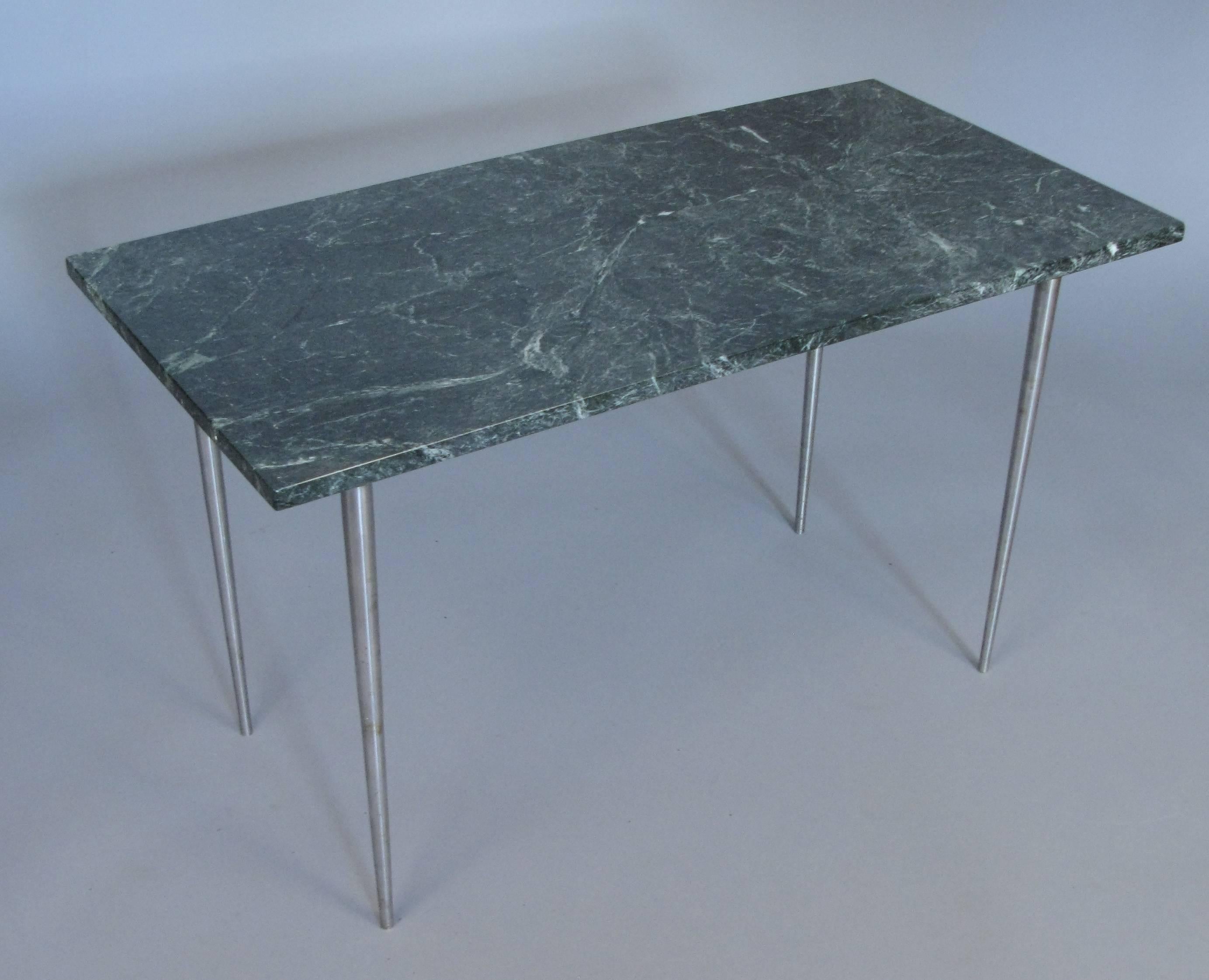 A very handsome vintage 1960s side table with brushed steel base with tapered tall legs and an Italian green marble-top. Elegant and spare design and in very good condition.