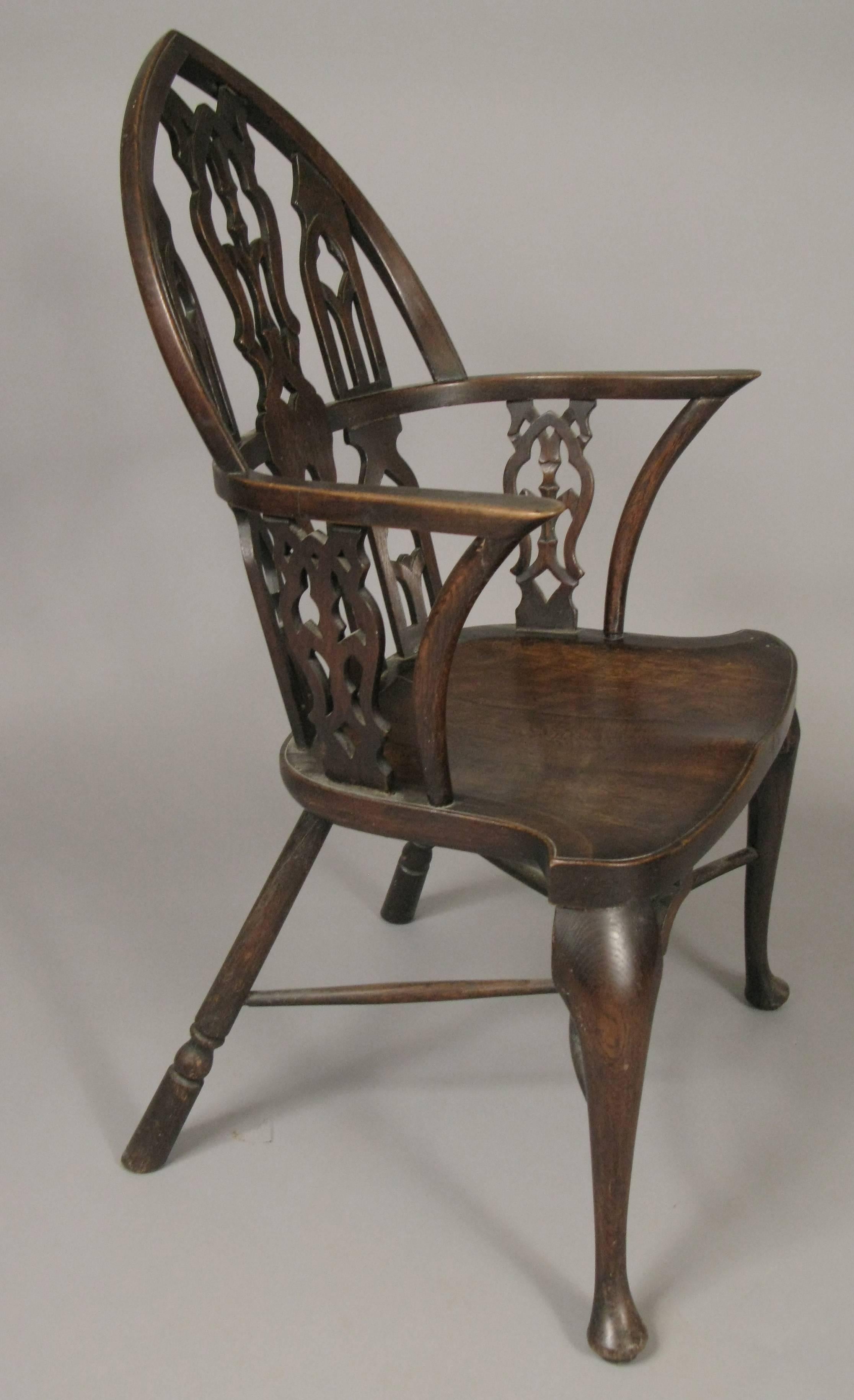 A very handsome early 20th century armchair with Gothic design backrest. very well made and beautiful patina.