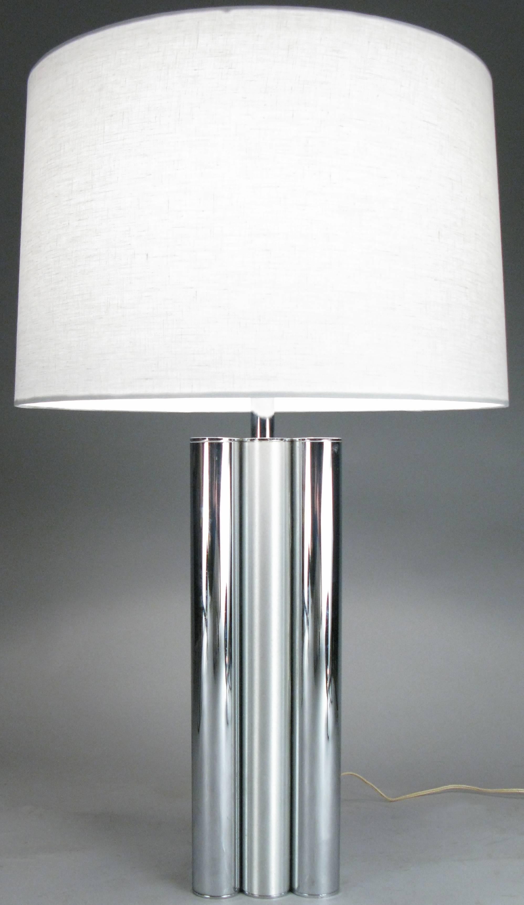 A pair of 1970s table lamps by Mutual Sunset, with bases composed of vertical tubes of alternating chromed steel and brushed steel, nine tubes total. With new linen shades and custom acrylic diffusers. Fantastic design.