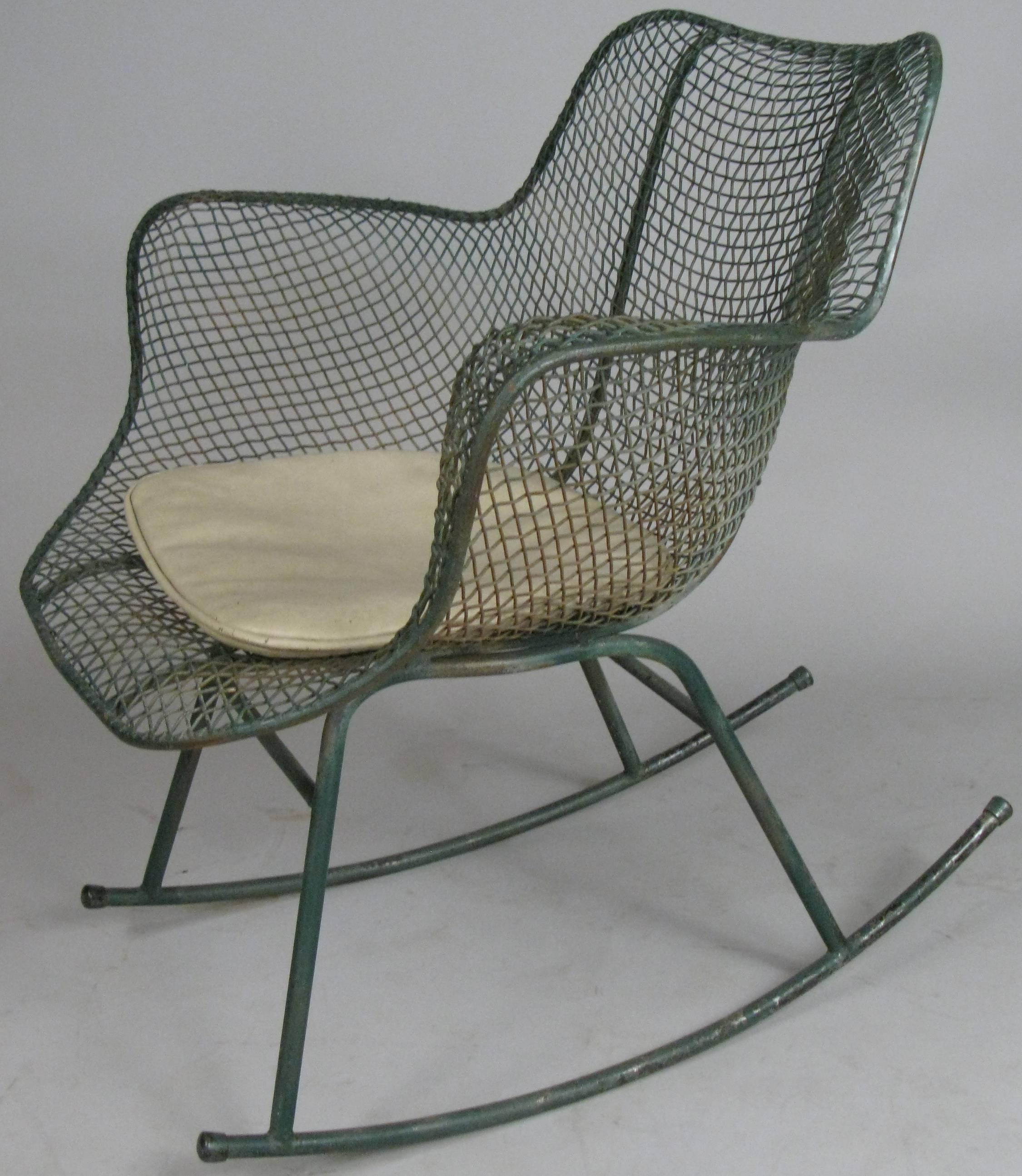 the classic and iconic vintage steel mesh Sculptura Rocking Chair designed in 1950 by Russell Woodard. in its original dark green finish, which is worn as expected for the age. can be custom finished in any color you choose. 