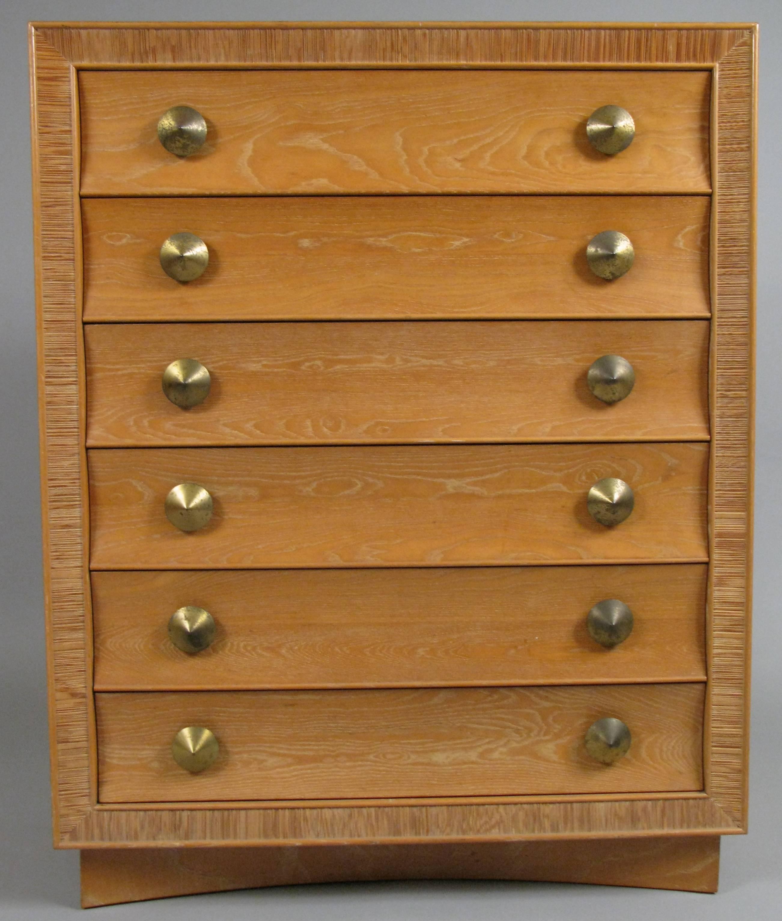 A very handsome vintage 1940s natural oak six-drawer chest with beautiful concave curved drawer fronts, a combed oak border, and the original conical brass hardware. Classic design and very nice original finish. Designed by Paul Frankl and made by