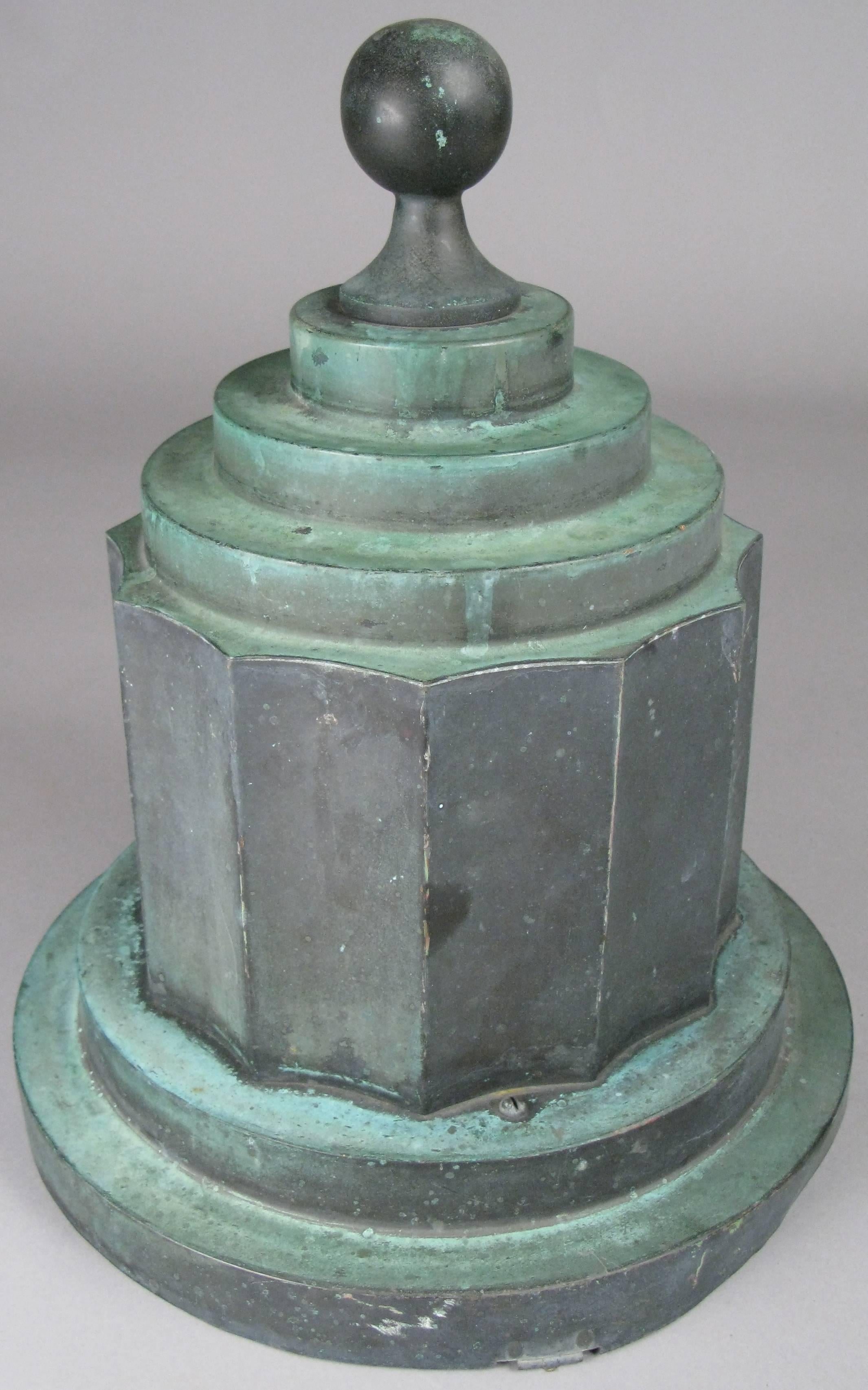 A large antique Art Deco copper finial with an outstanding patinated finish. Likely used as the top of a large lantern as seems to have had a hinge on one side and has a chain inside. Beautiful form and finish.