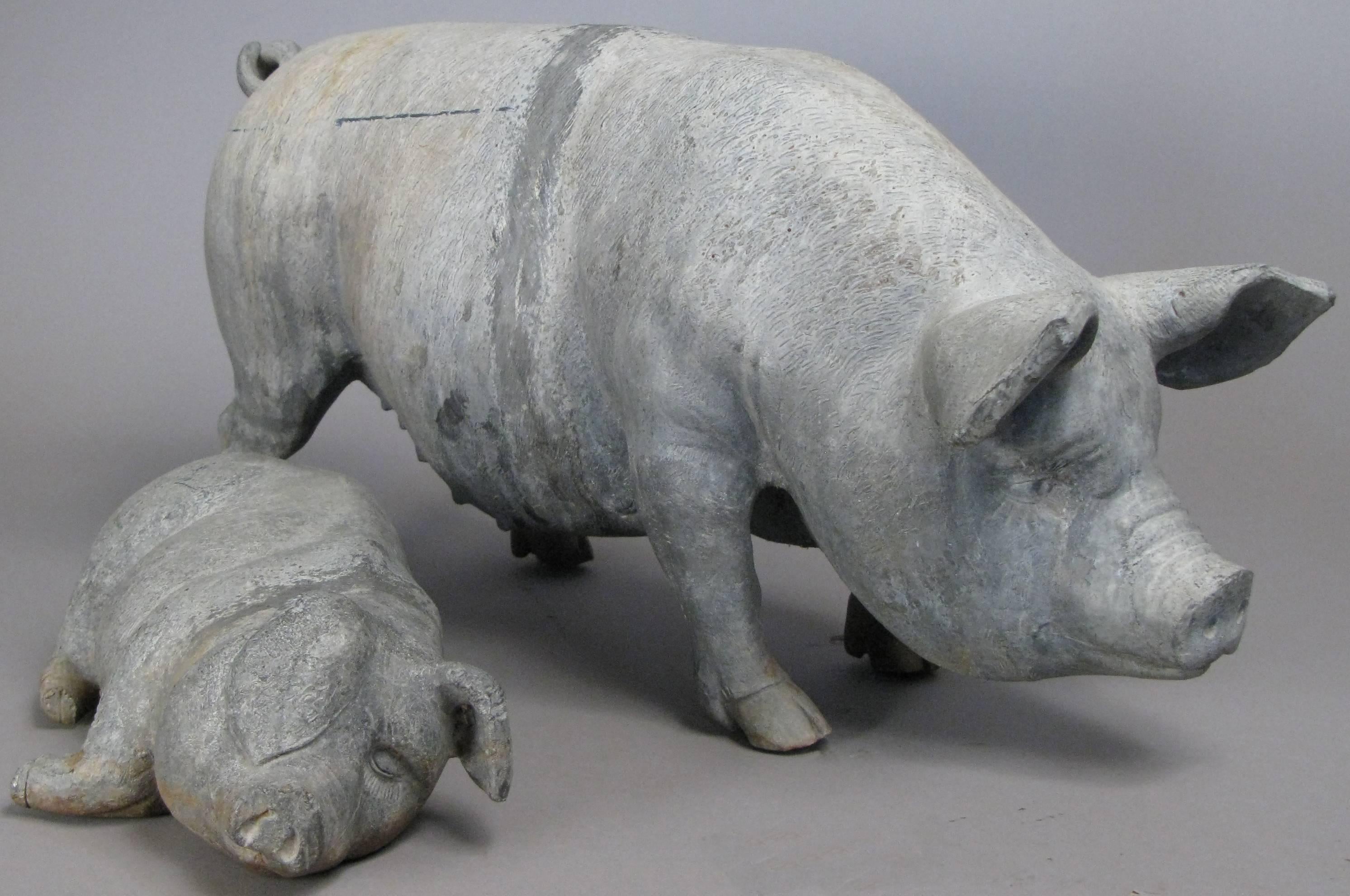 A wonderful and charming English lead garden pig and companion piglet. Very well made, with beautiful details.