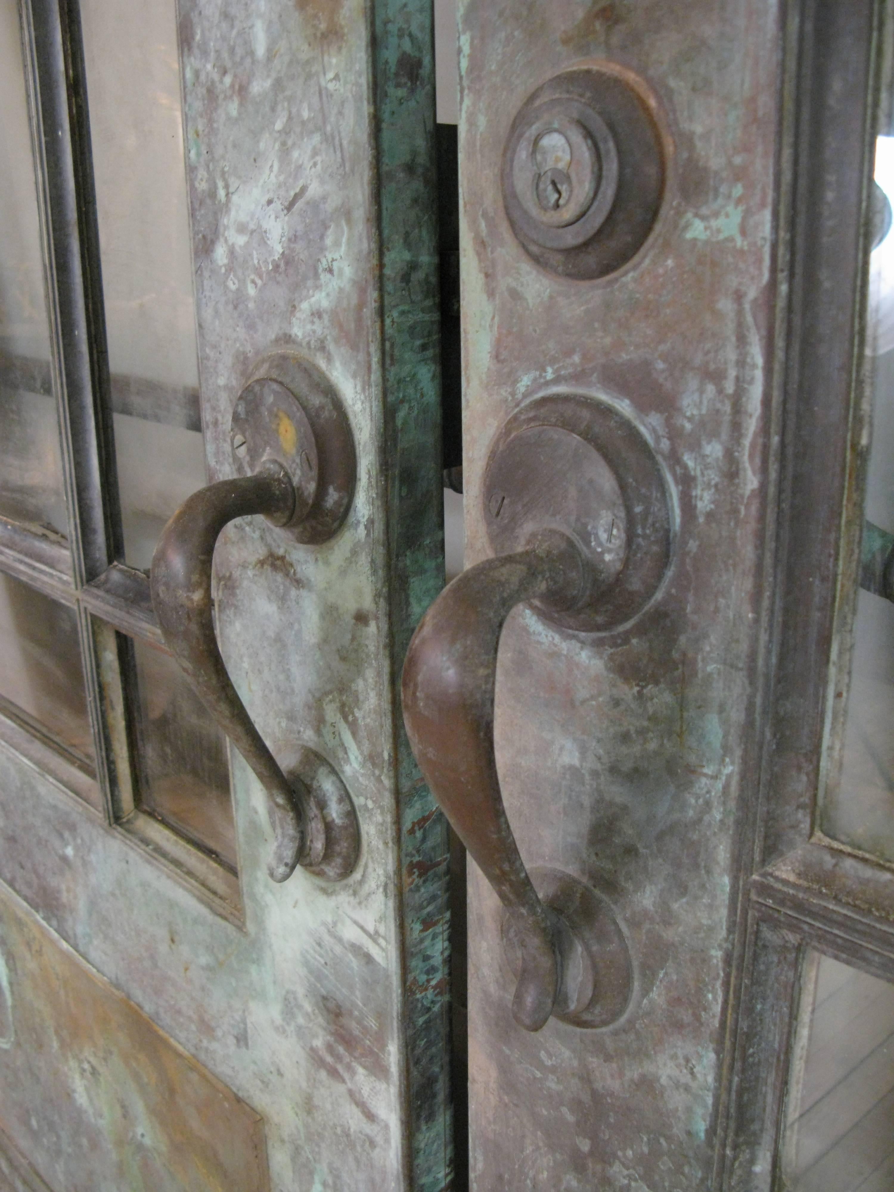 20th Century Pair of Antique Bronze and Glass Doors