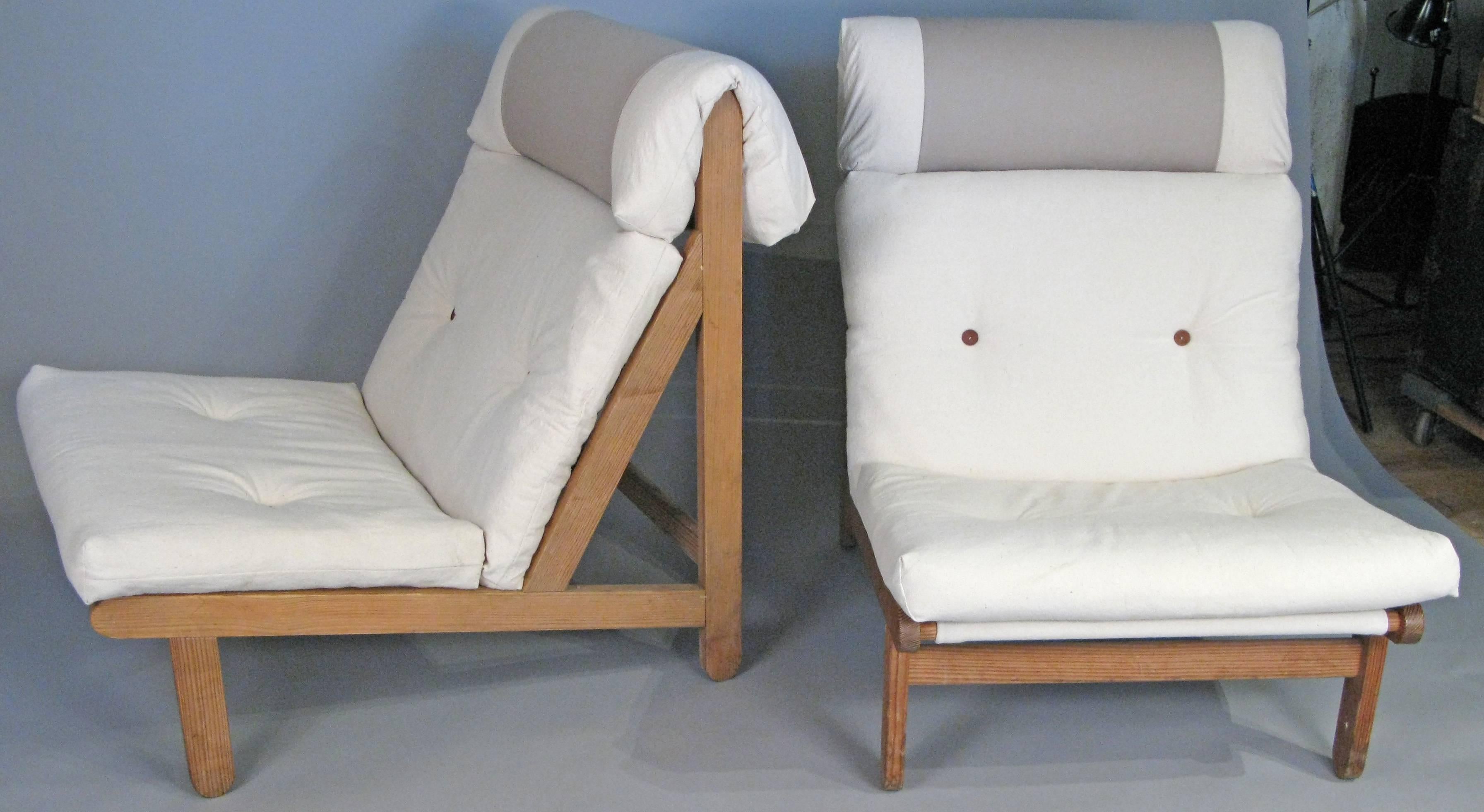 A very handsome and comfortable pair of 1960s Danish 'A Frame' Lounge chairs designed by Bernt Petersen. Beautifully made oak frames, with cushions newly recovered in cotton canvas, with the original leather buttons.