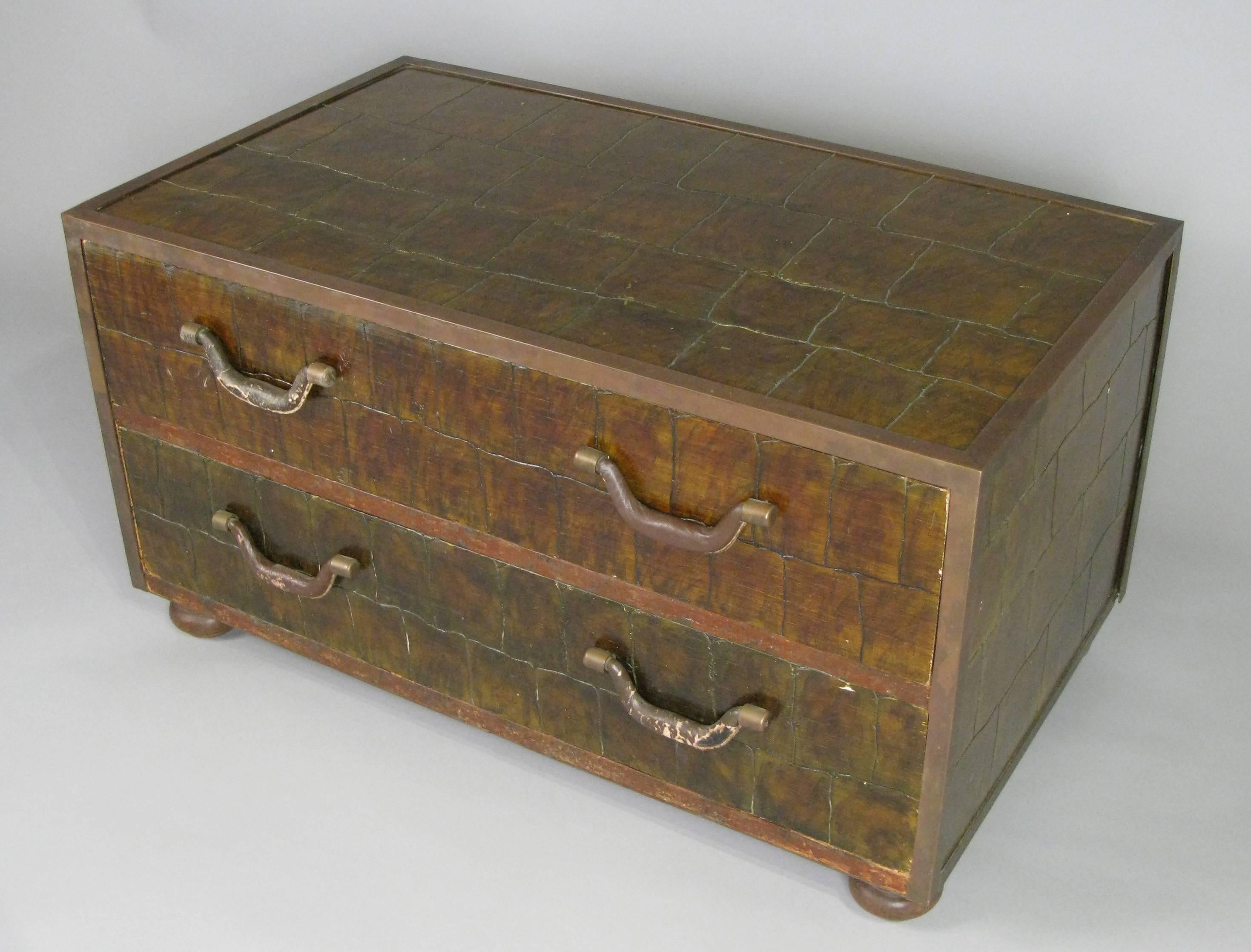 A vintage 1960s two-drawer chest made in Spain by Sarreid, with a crocodile pattern and leather wrapped handles.