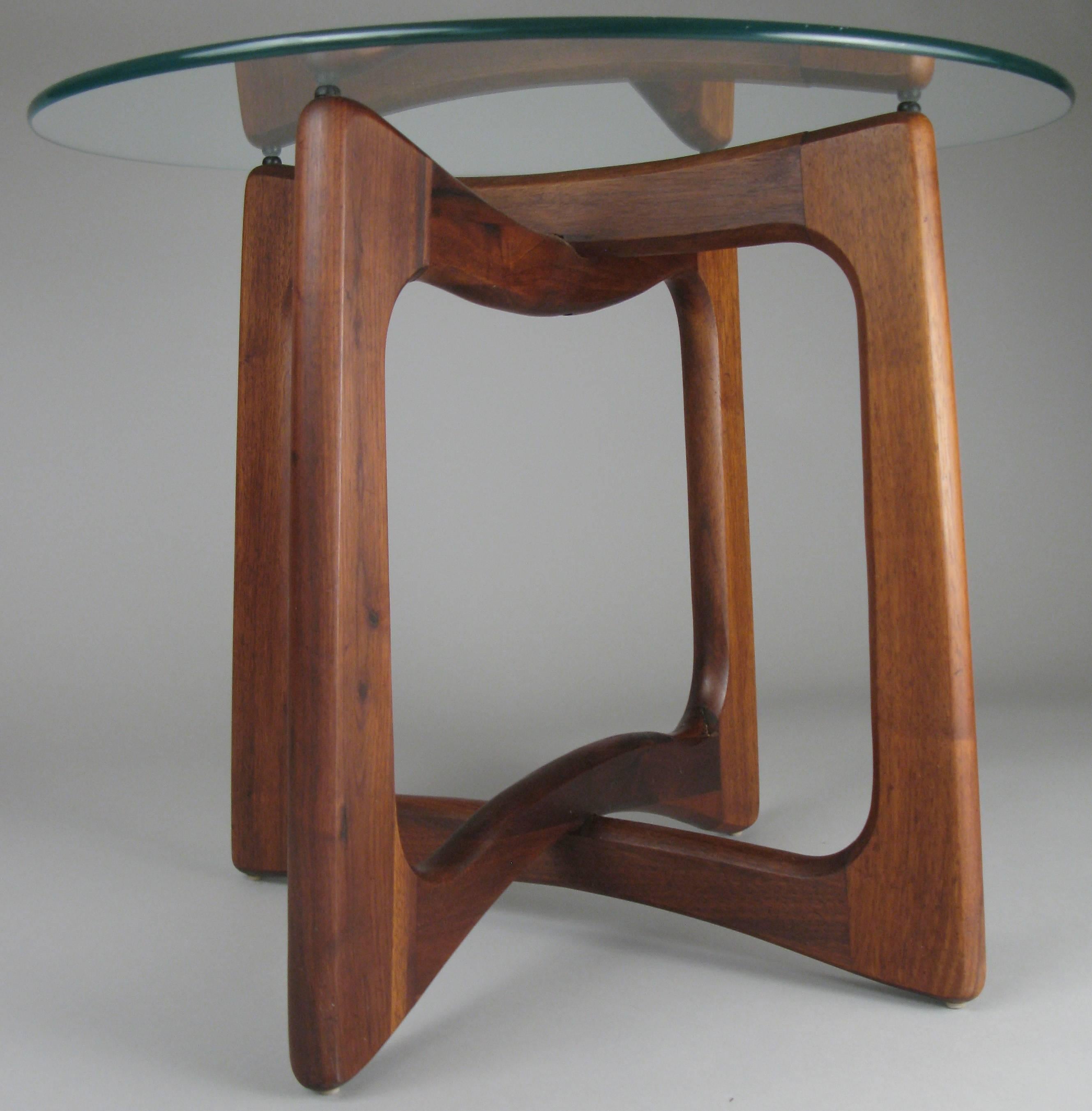 A beautiful pair of vintage 1960s modern tables designed by Adrian Pearsall for Craft Associates. Bases formed with interlocking open forms in solid walnut with round glass tops. Engaging design and impeccable craftsmanship.