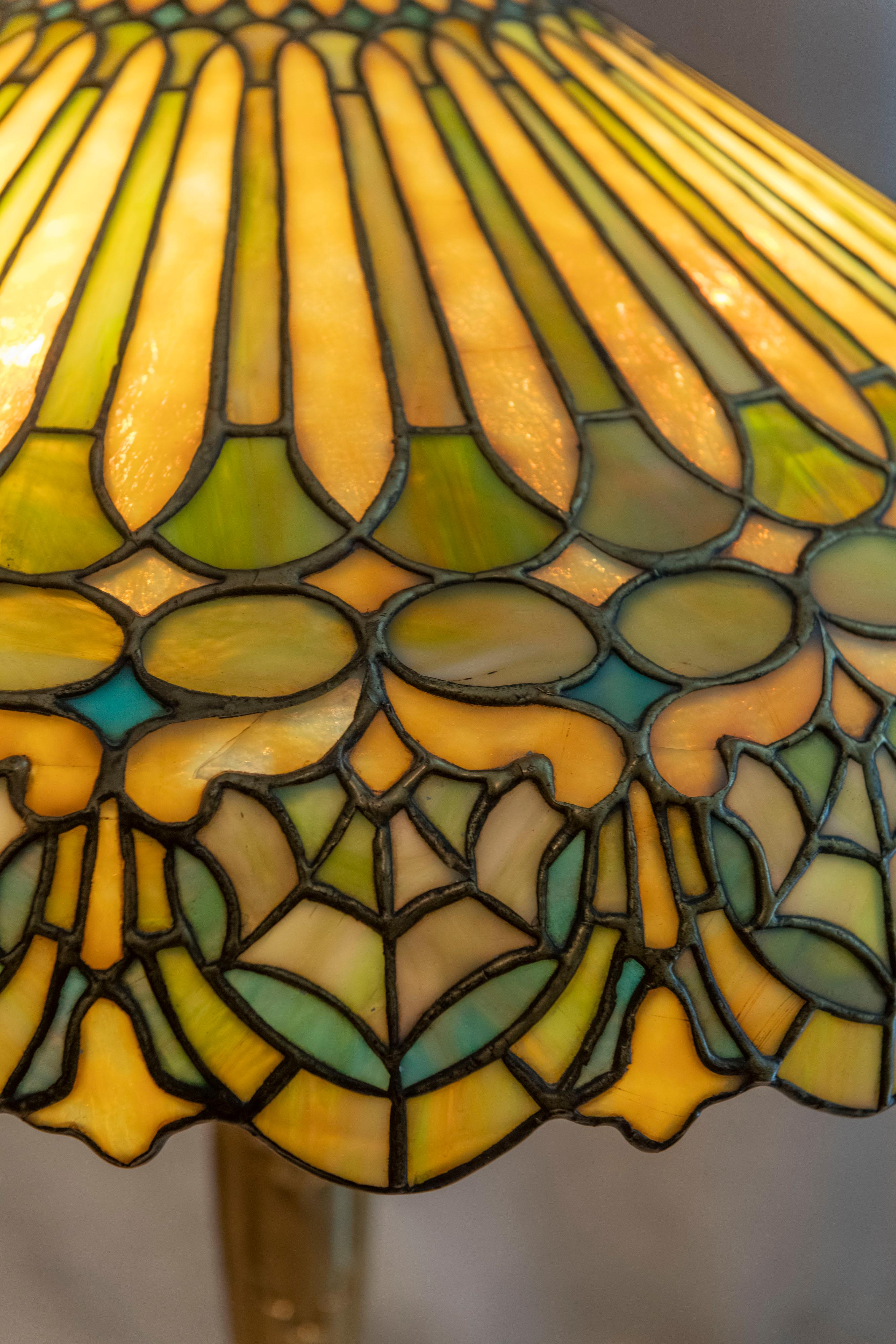 This large and impressive lamp was done by the Duffner & Kimberly Co. ca. 1910. They made some of the most impressive leaded glass lamps of the period. They were the chief competitor of Tiffany Studios. Also located in New York. This particular