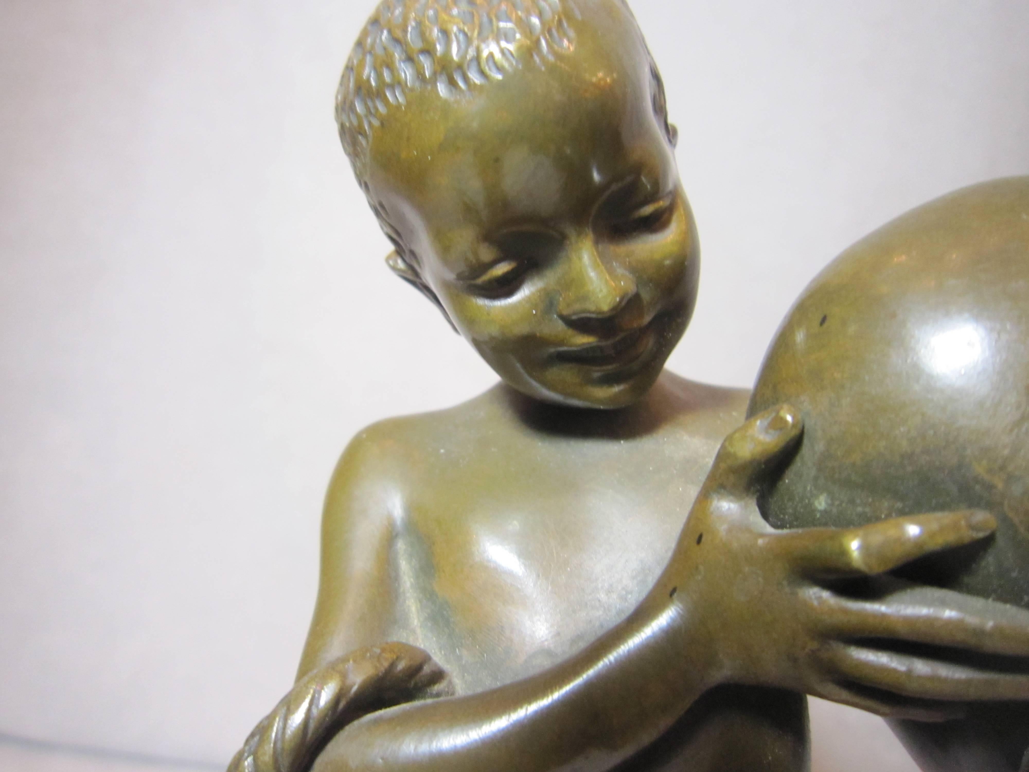 This very endearing sculpture of a young Orientalist boy is artist signed 