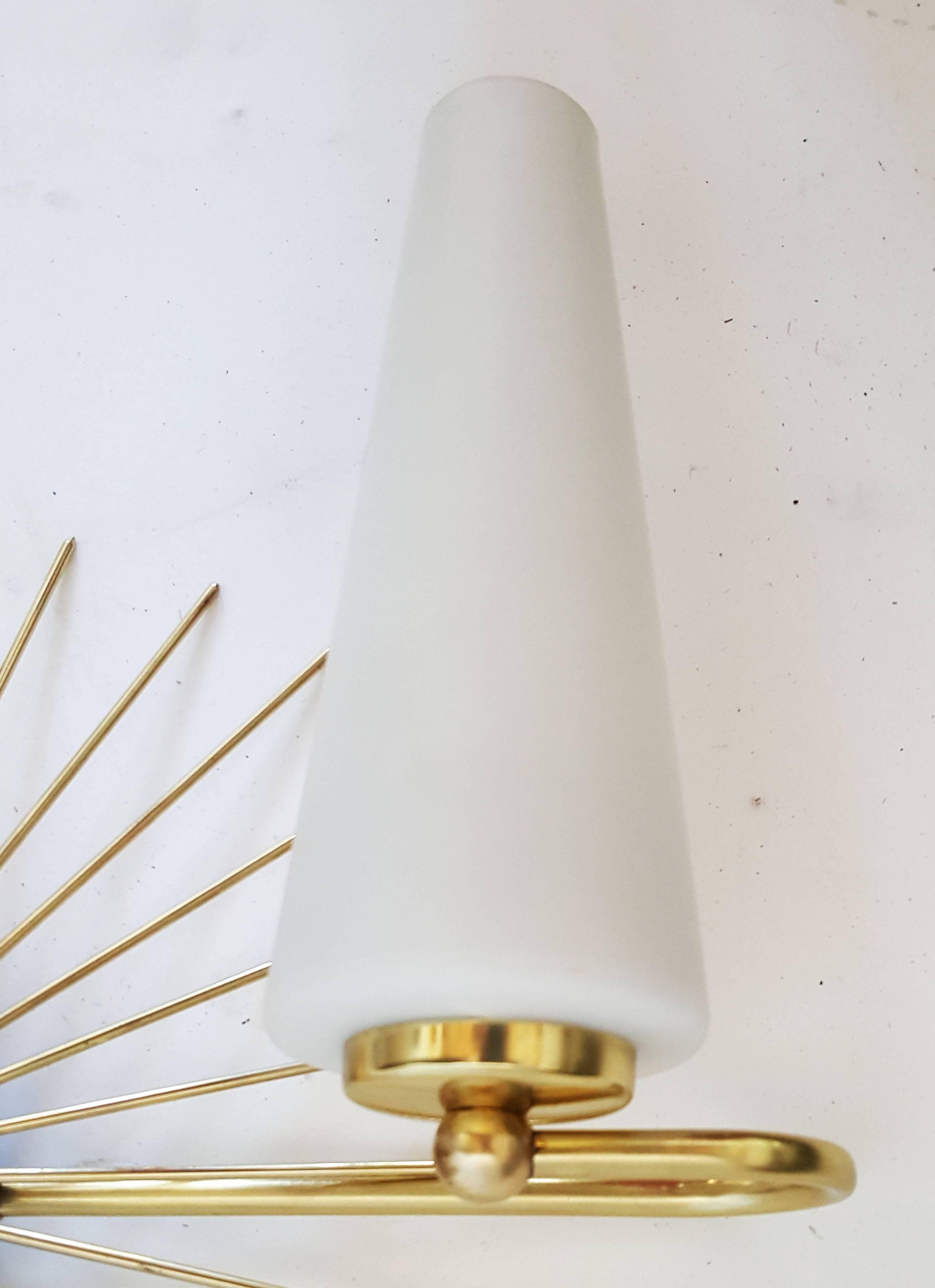 Brass Pair of Maison Lunel Sun Sconces For Sale