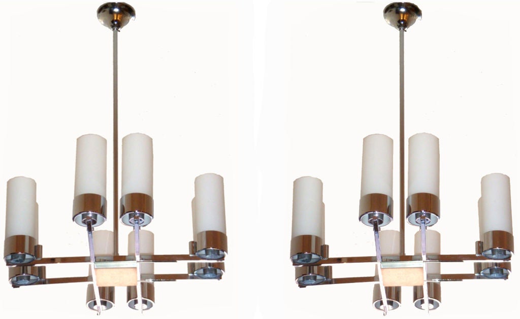 French chandelier by Jacques Adnet, 8 opalines tubes.
Adjustable height. Pair available.
US wired and in working condition.
