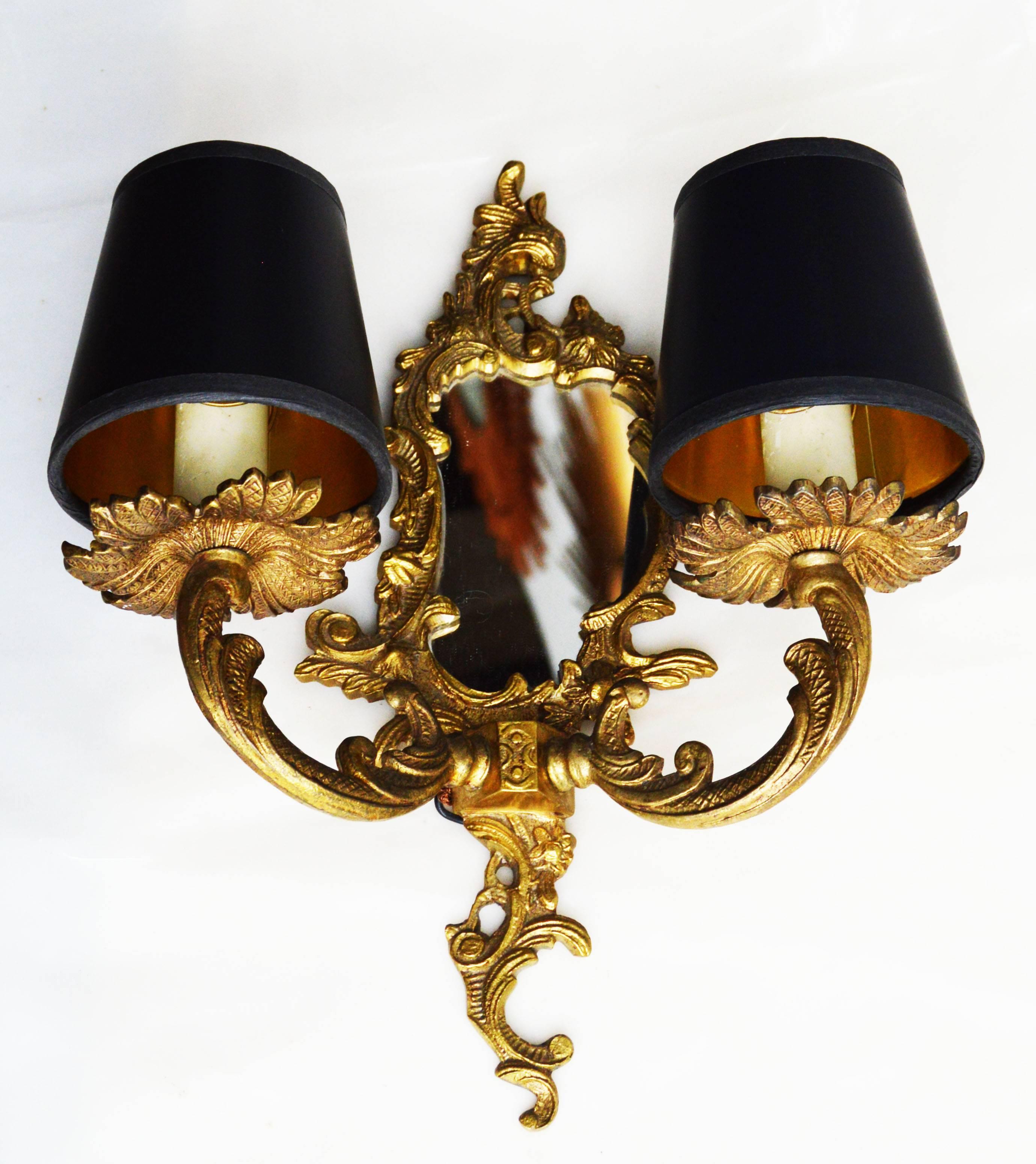 Pair of French Louis XV Rocaille style bronze pair of sconces with mirror.
Wired for US and in working condition.
Shades not included.
Measures: Mirror: 4" H.
Projection from the wall: 5".
Have a look on our impressive collection of