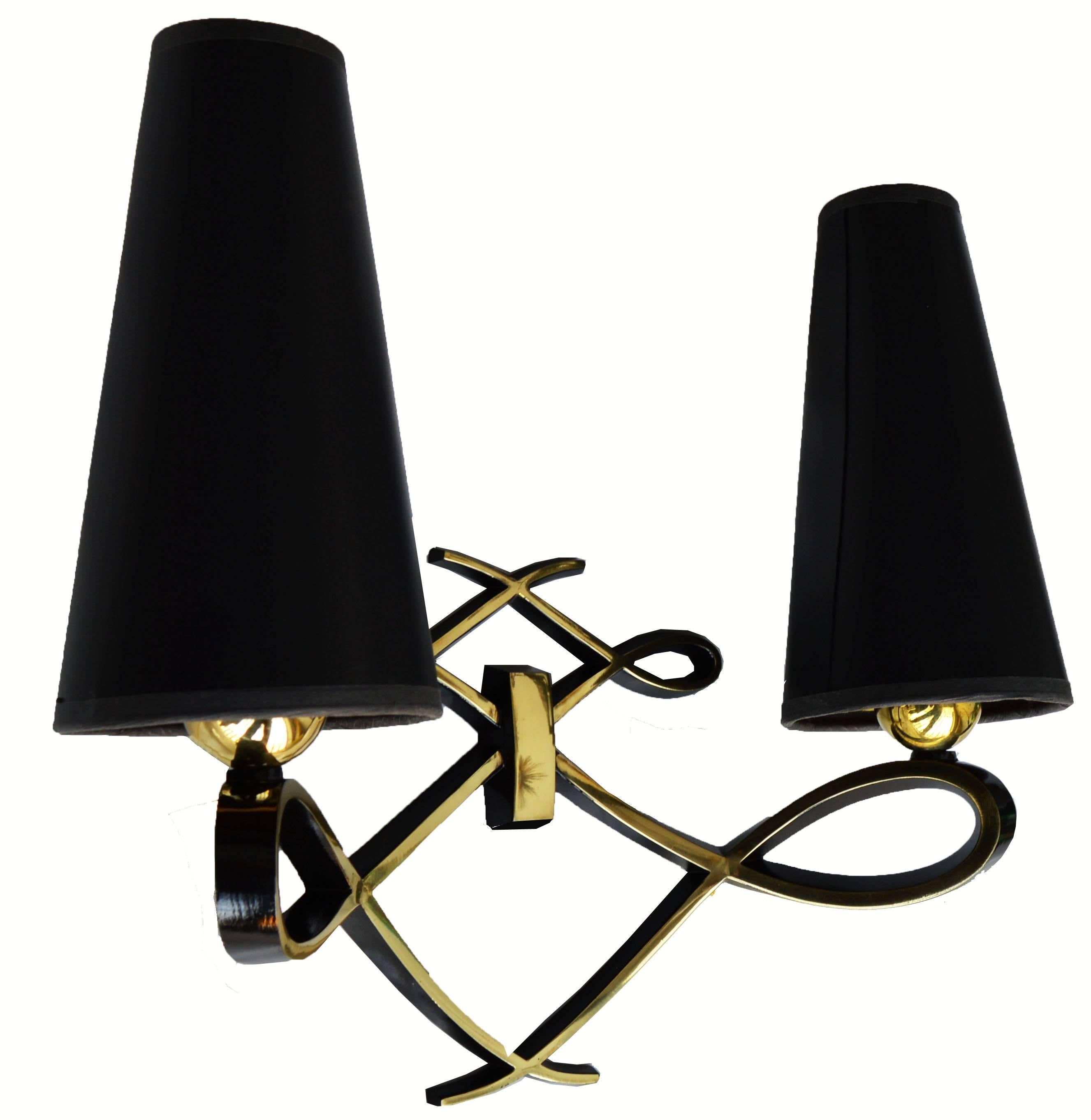 Superb pair of sconces by Arlus in Jules Leleu style, 3 pairs available.
Priced by pair
US rewired and in working condition.
Two lights, 75 watts max per bulb.
measurements without shades : 9