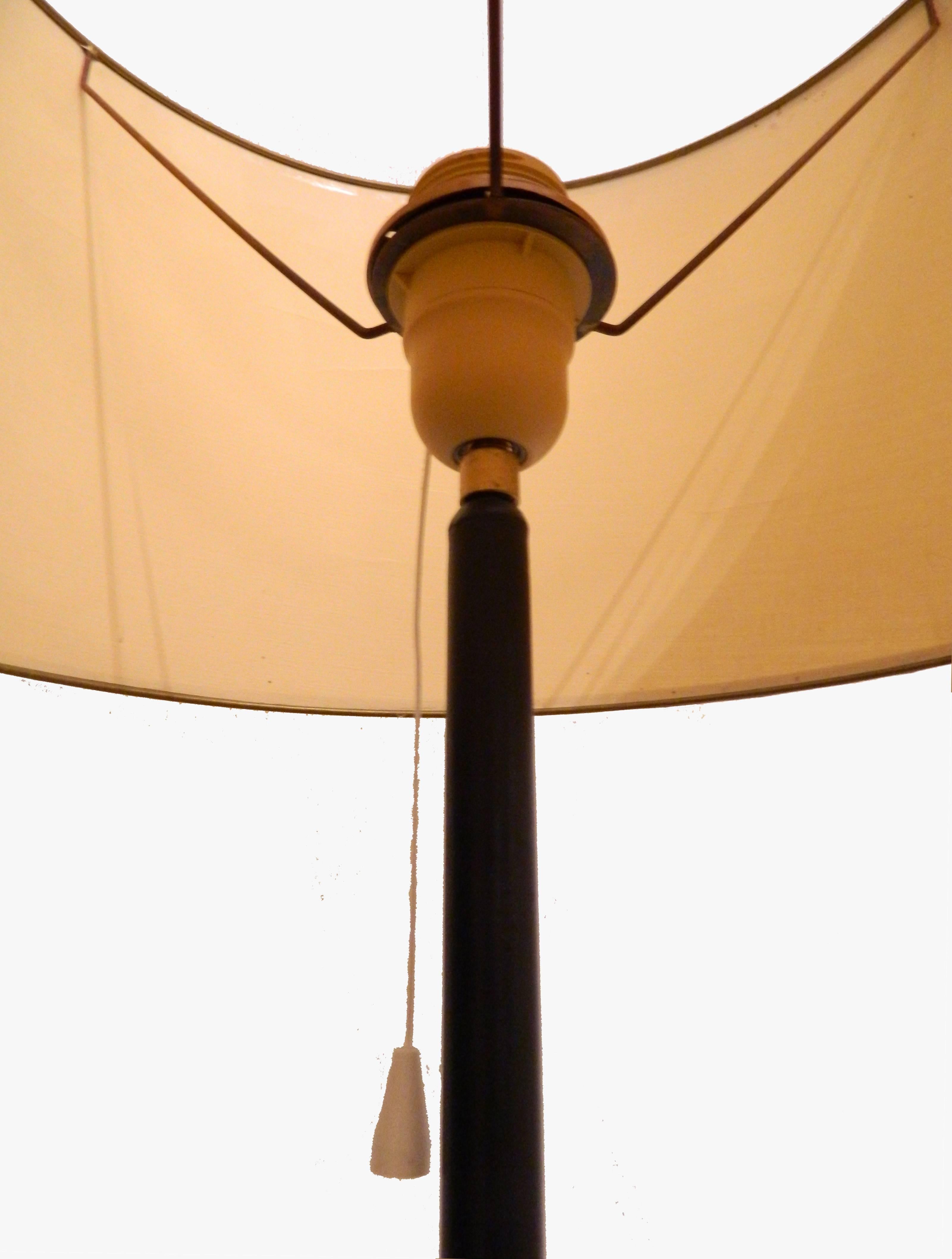 Nice Jacques Adnet style floor lamp in black iron and brass, original shade.
One light, 100-watt maximum.
US rewired and in working condition.