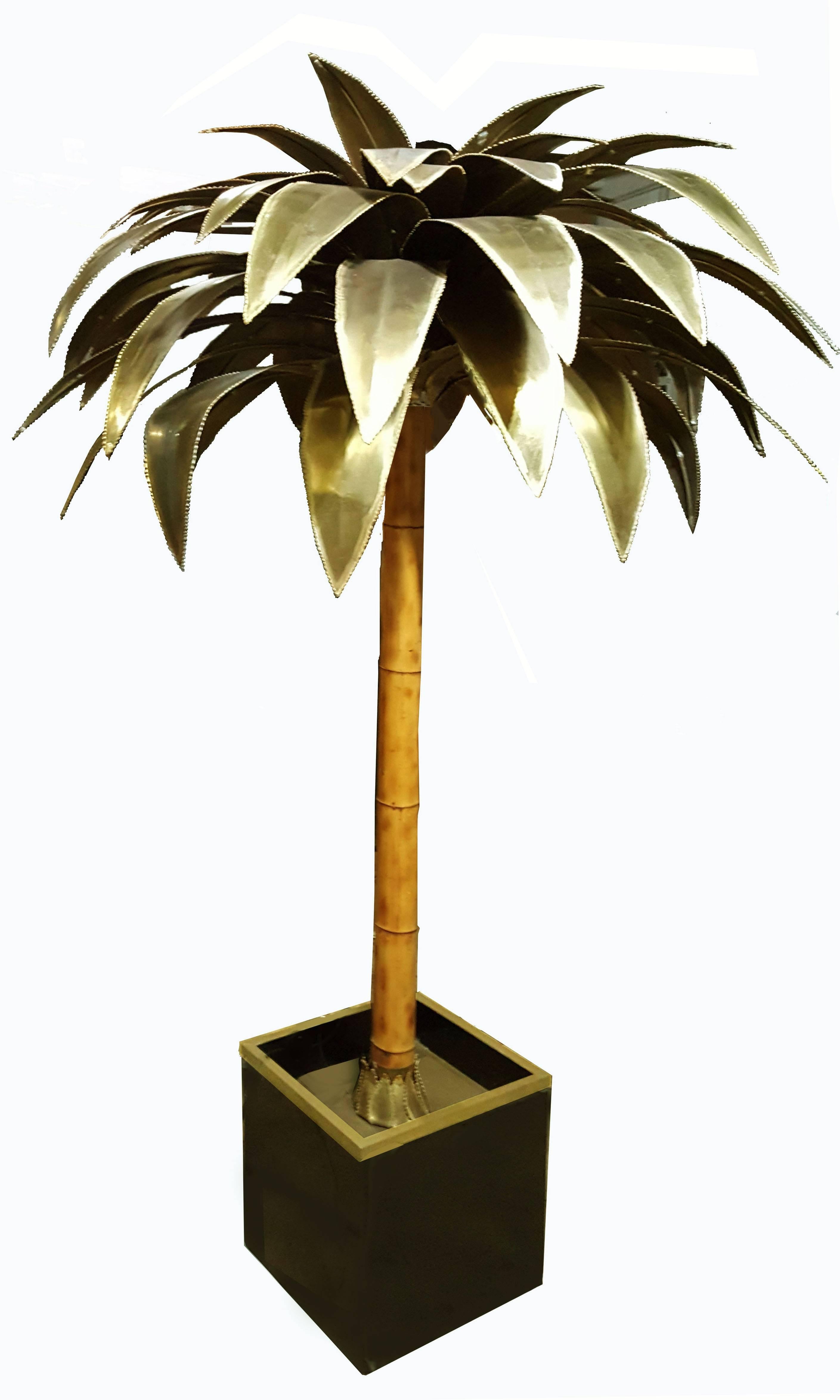 Somptuous 7ft H bronze, brass and bamboo, circa 1965s Maison Jansen palm tree.
Provenence: Palace Hotel in La Baule, France.
Wired for US and in working condition.
Five-light, on the top: 100W, four in the palms: 75W each.
Measuring base: 16inches