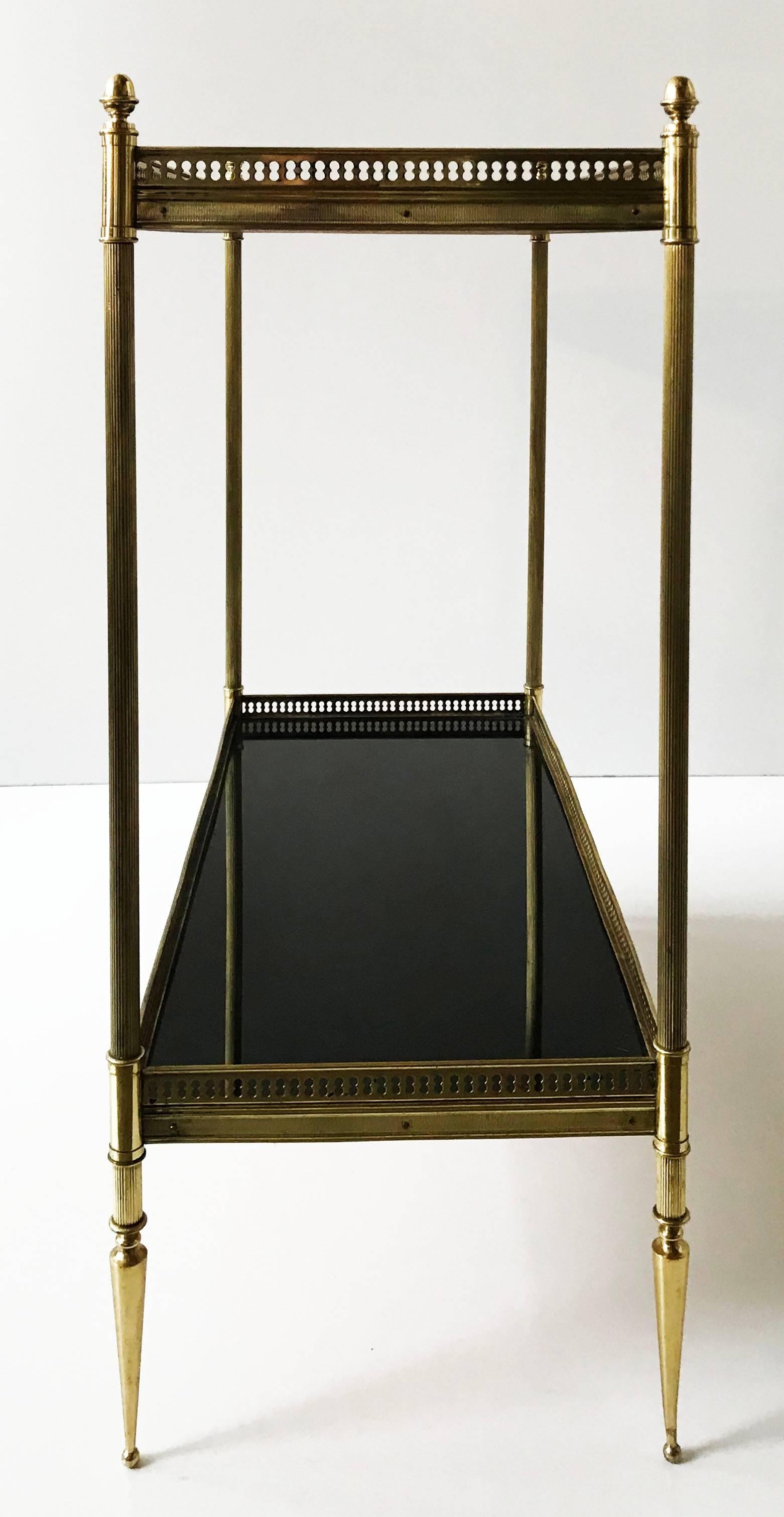 Superb pair of Maison Jansen side table, brass frame and black glass top
two tiers. 

from the floor to the first tier: 8 inches H.