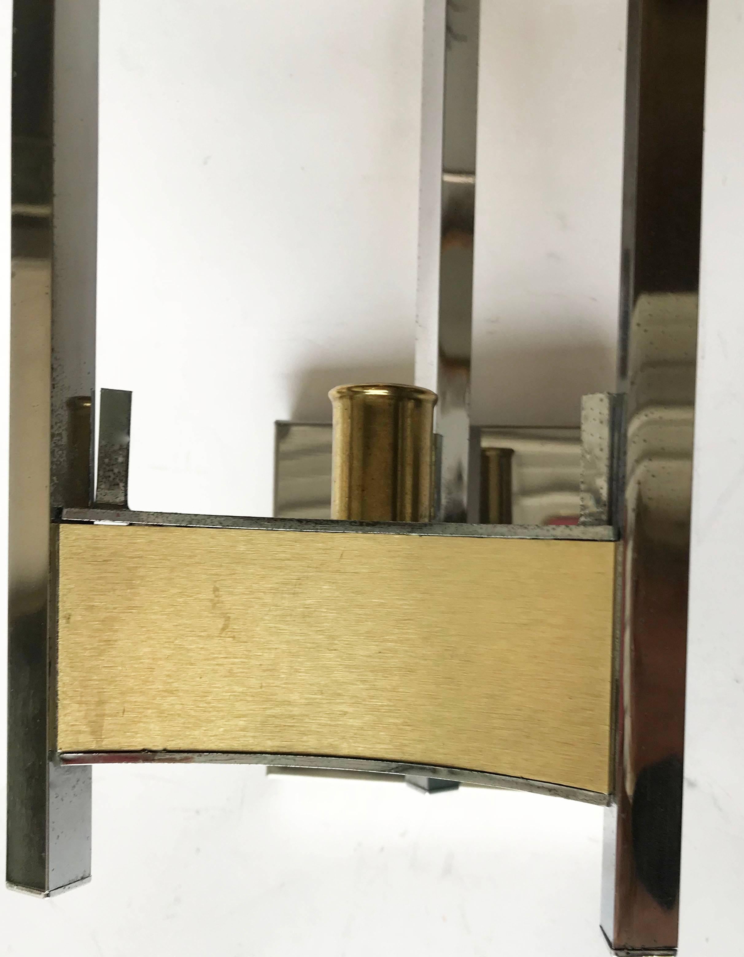 Pair of one light Gaetano Sciolari sconces, brass and chrome finish 
US rewire and in working condition 
One light, 100 watts max bulb
 Square back plate: 4.3/8 inches x 4.3/8 inches.
Two pairs available. Priced by pair.