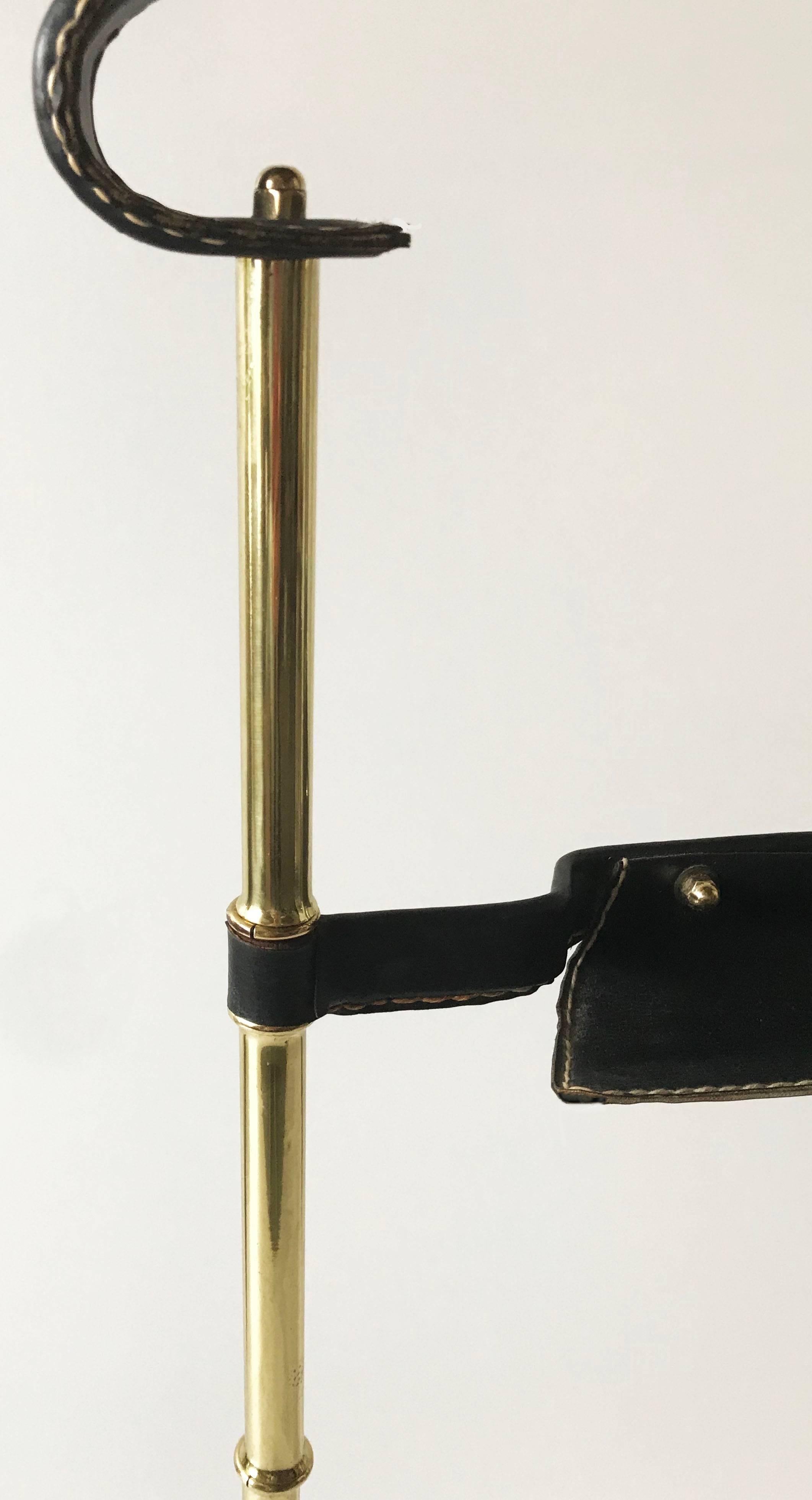 The so Classic and classy French Mid-Century Modern Jacques Adnet leather and brass valet.
Base measures: 16 inches L. 15 inches W.