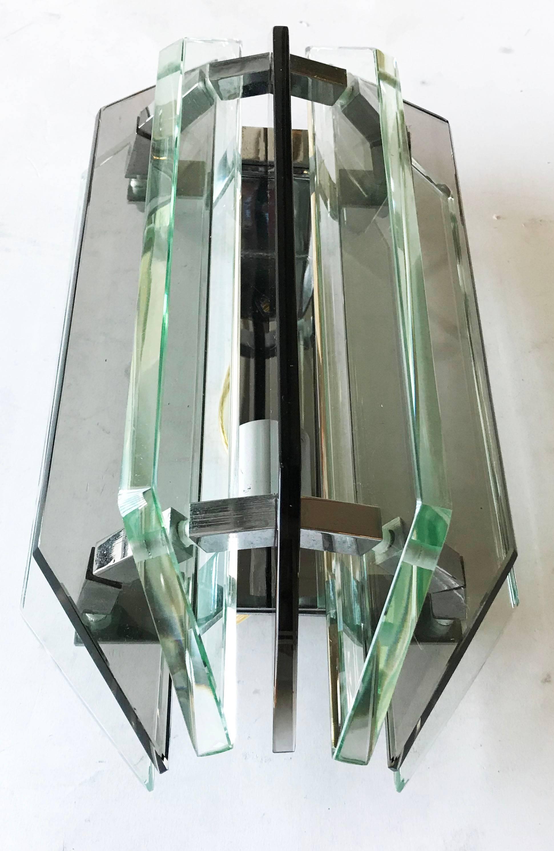 Superb pair of Italian sconces by Veca. Two color of glass, clear and green
US rewired and in working condition.
One light, 60 watt max bulb
Custom backplate available.
 
