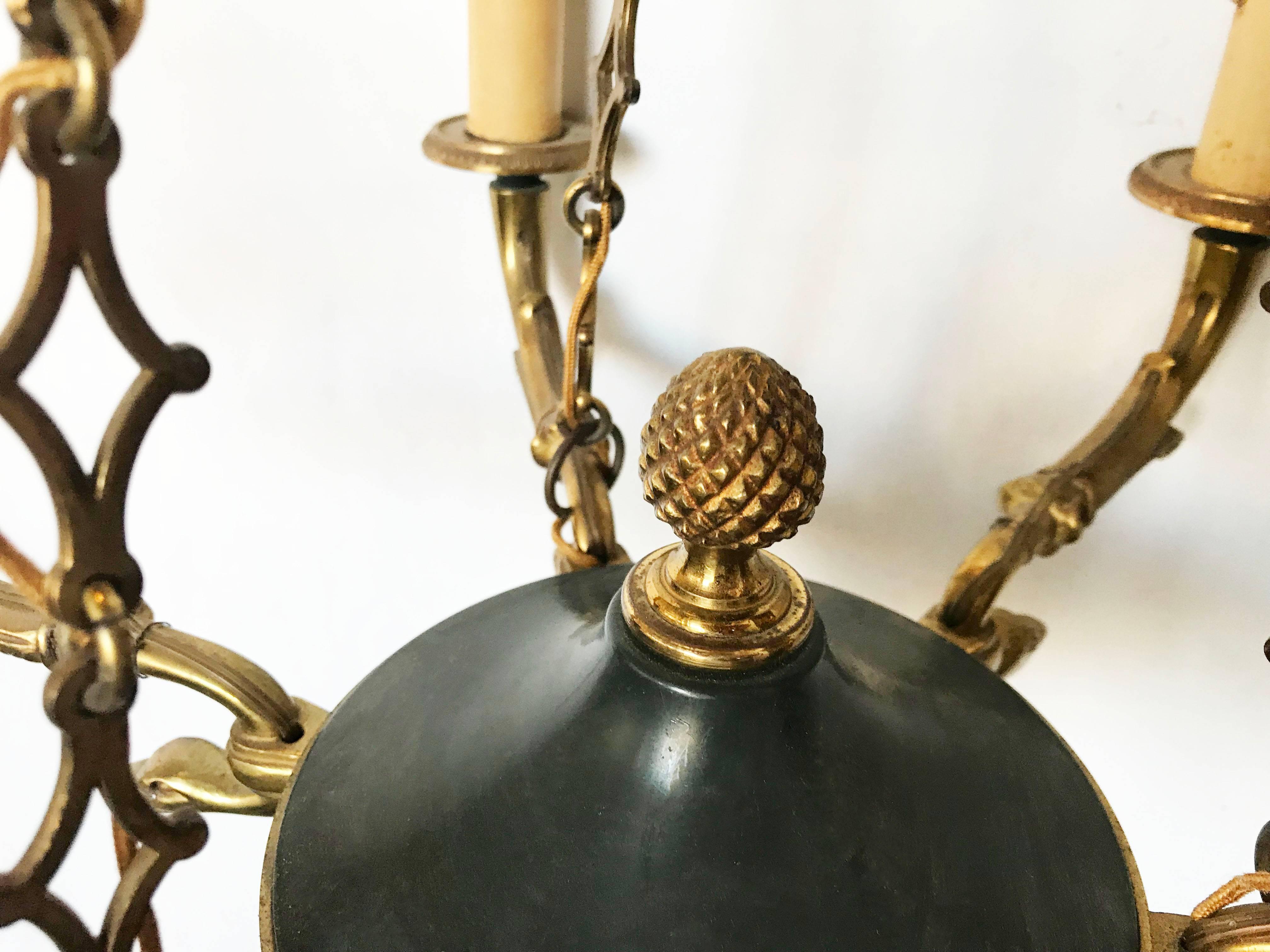 Elegant and heavy first French Empire style chandelier in Bronze made in France in the 1940.
Takes six lights 60 watts max per bulb.
Original patina, good vintage condition.