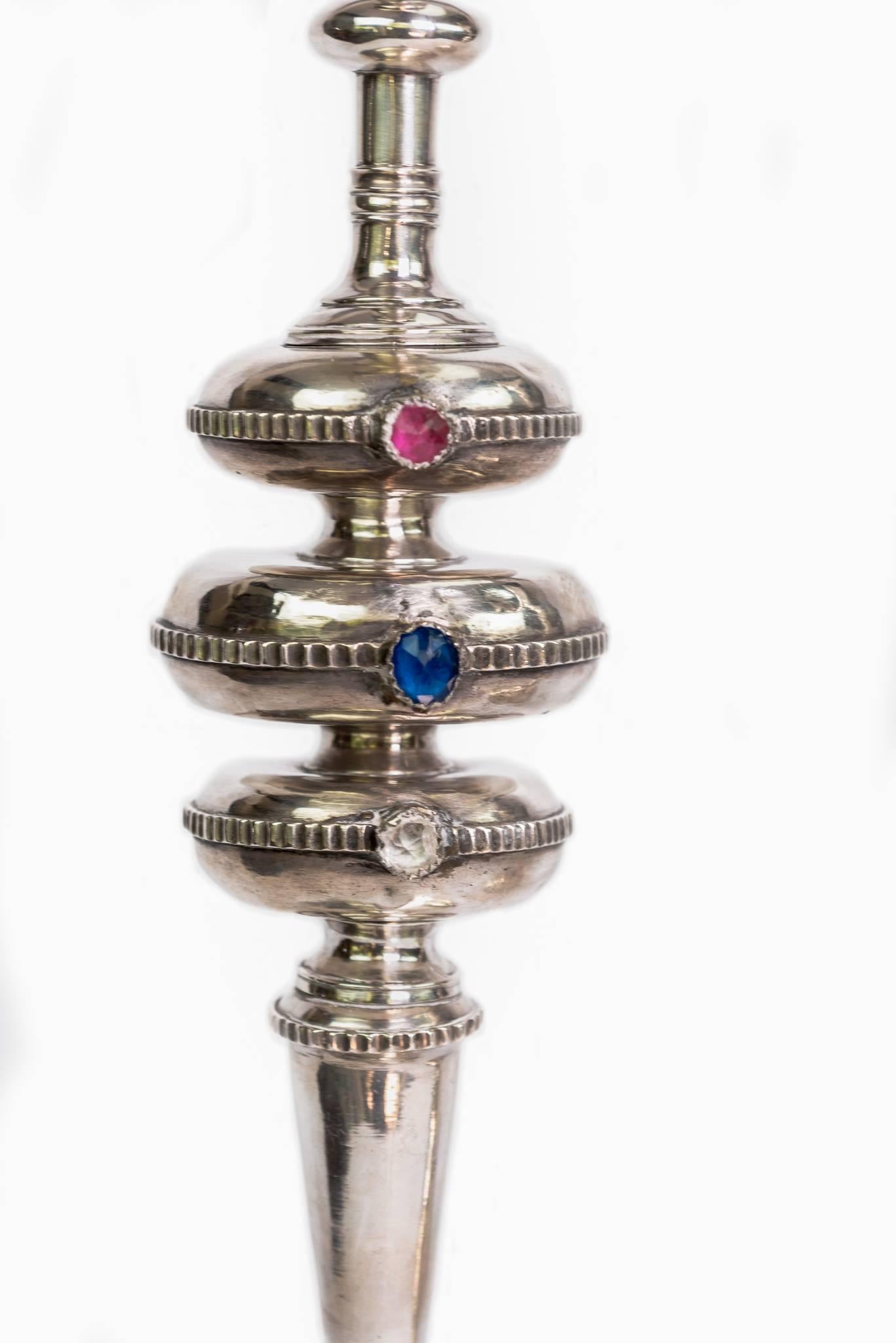These magnificent sterling silver candlesticks are signed and dated with the owners name. There are visible marks by the maker on the bottom. They are spool design with some repoussé and appliquéd trade beads. They were found in the private chapel