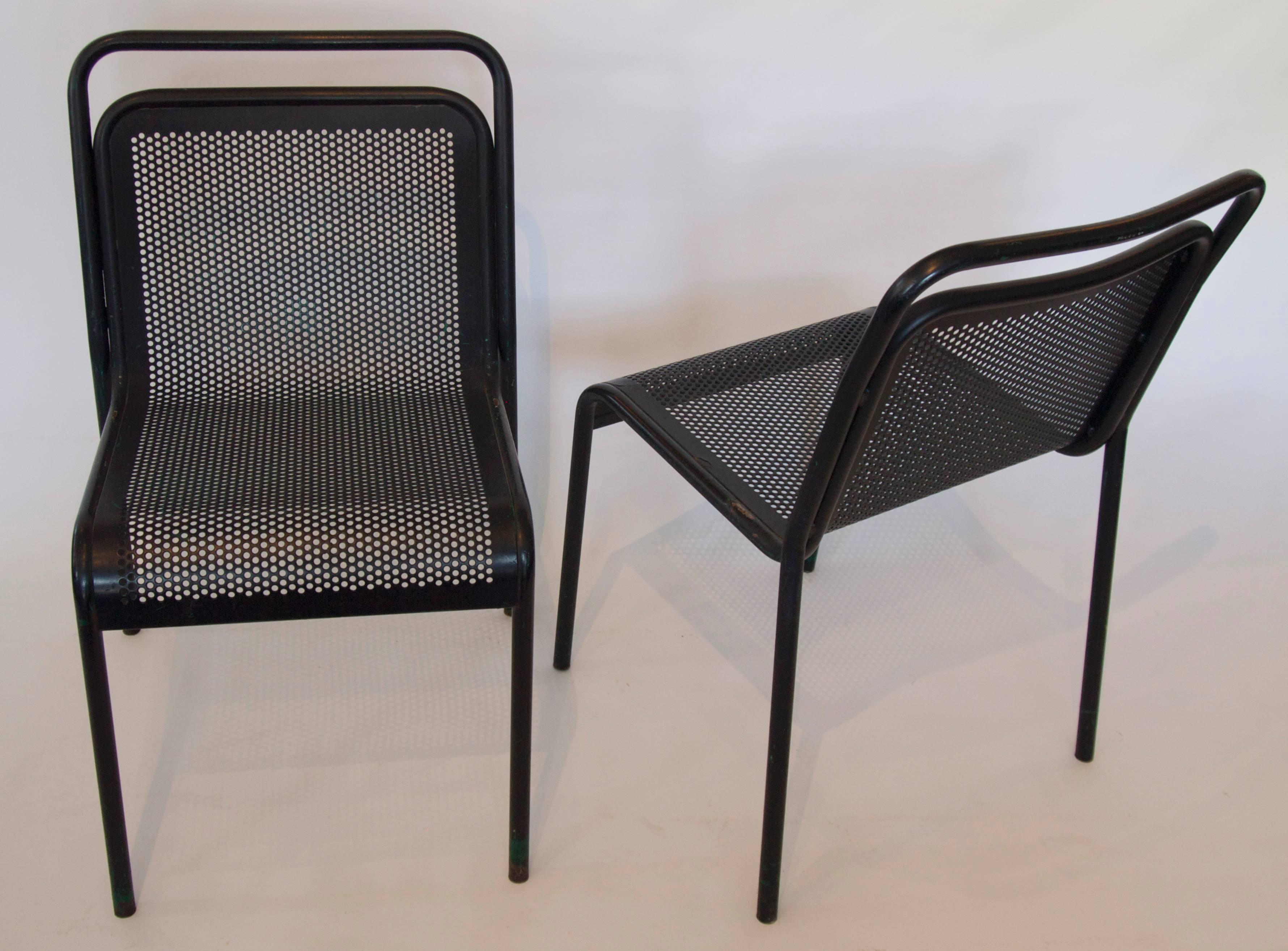Wonderful set of 5 French black painted perforated metal stacking garden chairs form the mid-20th century.
