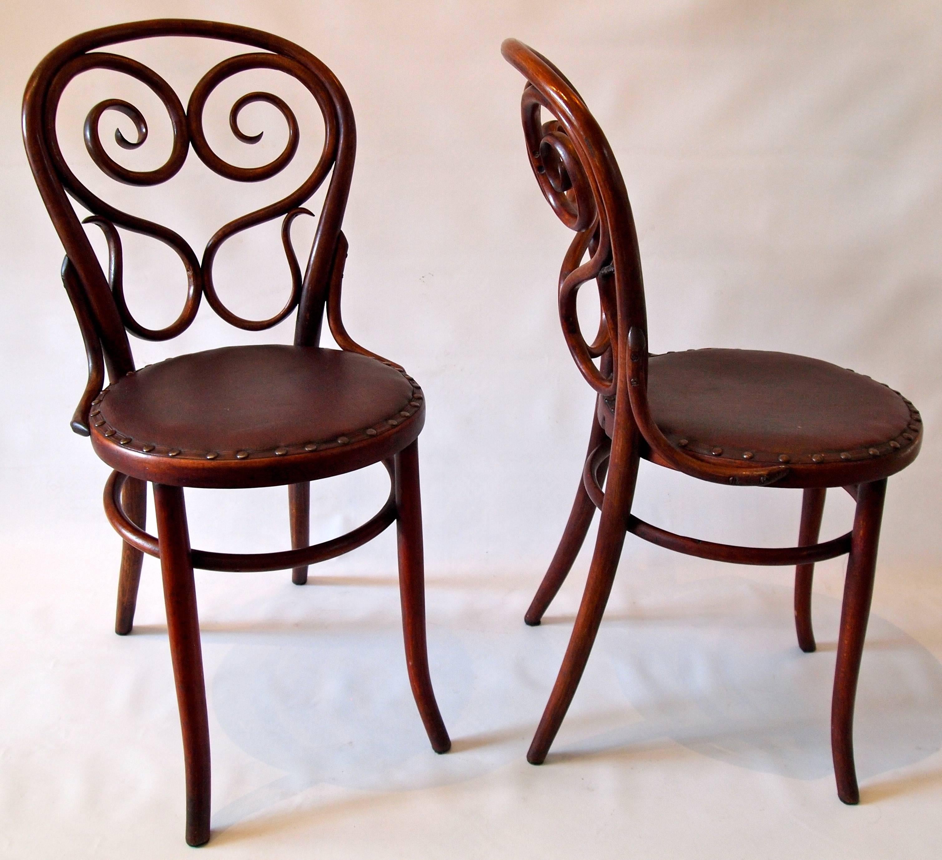 Wonderful set of four bentwood side chairs by Thonet with original upholstered seats,
circa 1900
Vienna.