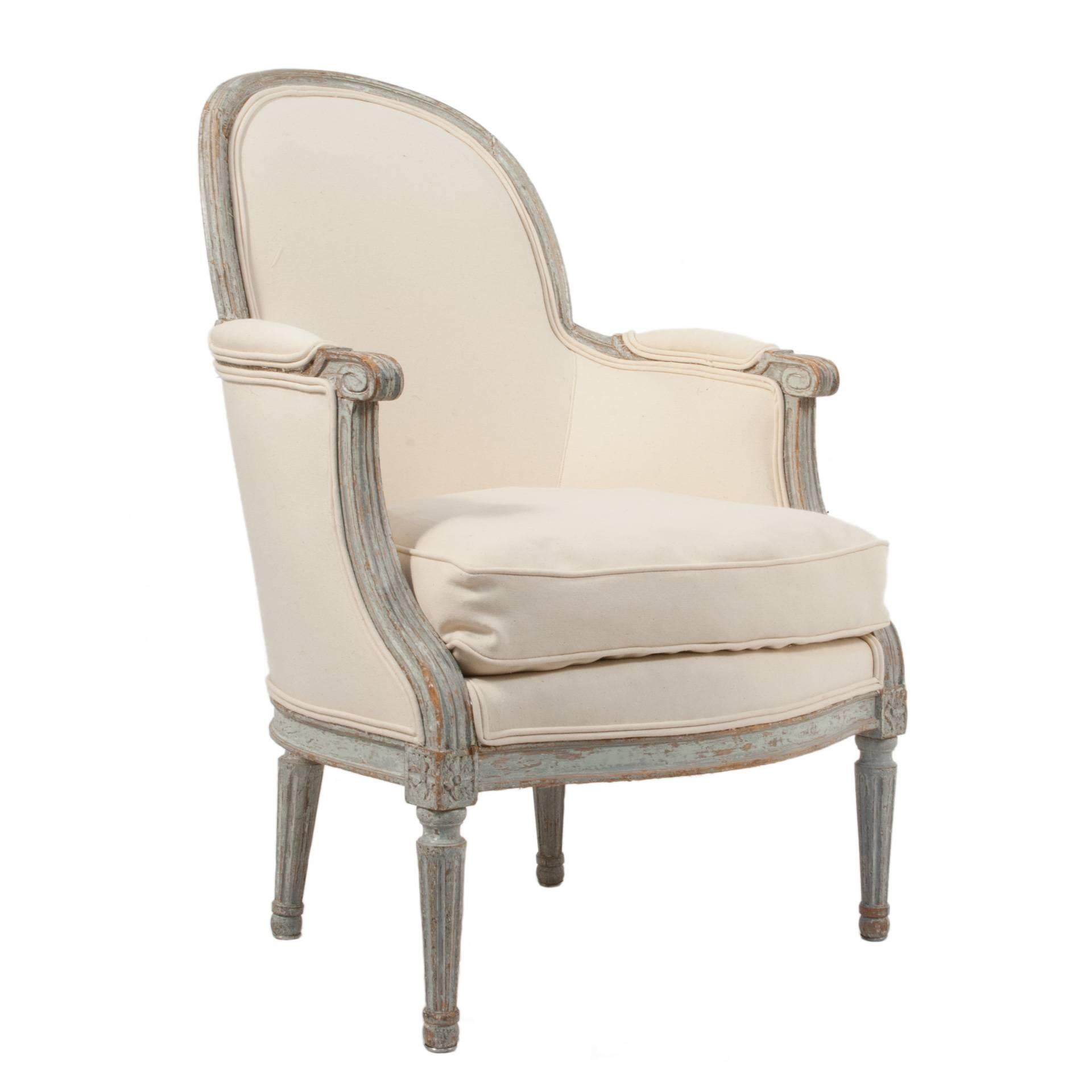 Pair of Gustavian Bergeres chairs in a worn pale blue patina.