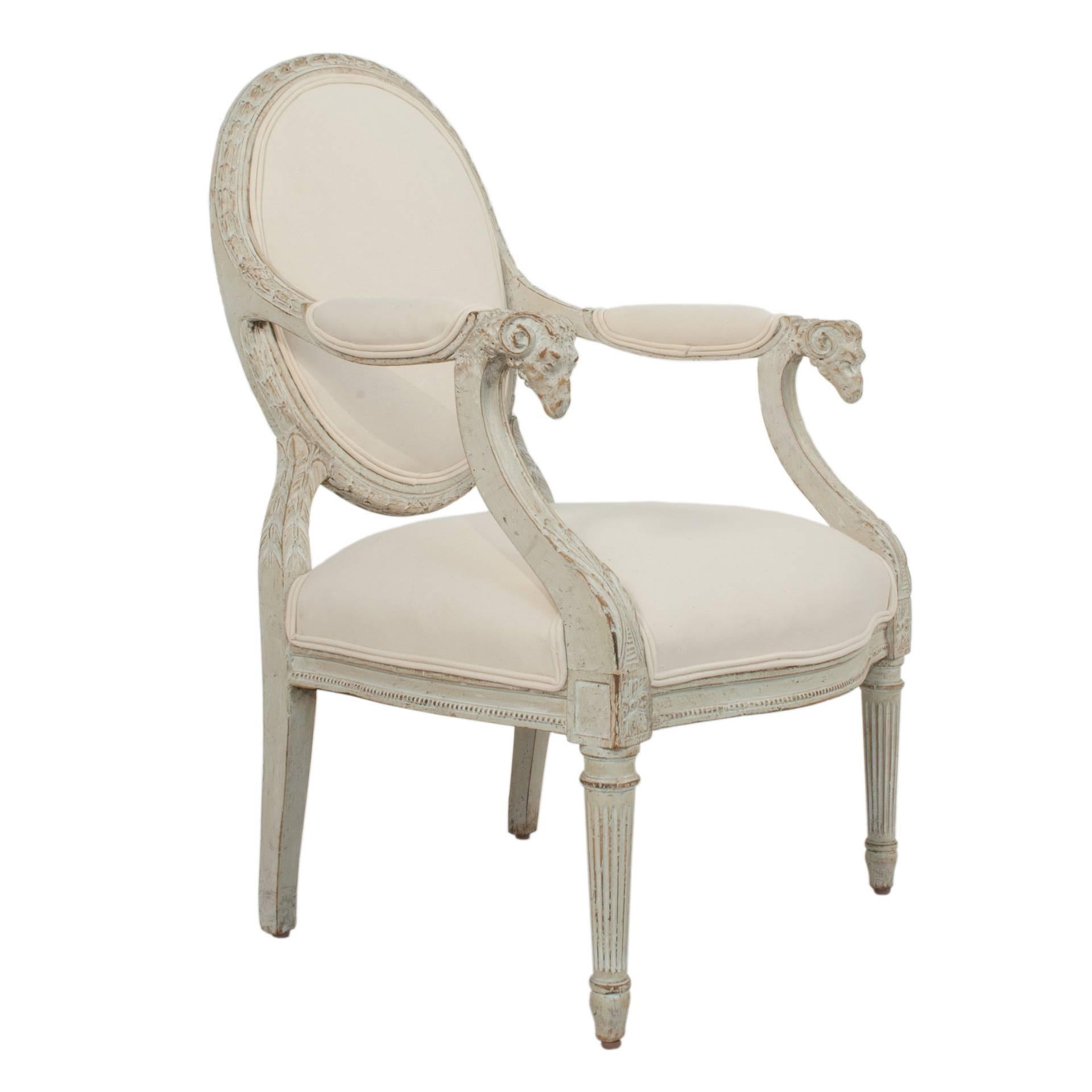 Louis XVI armchair with a worn pale grey patina in the art of Jacob.
