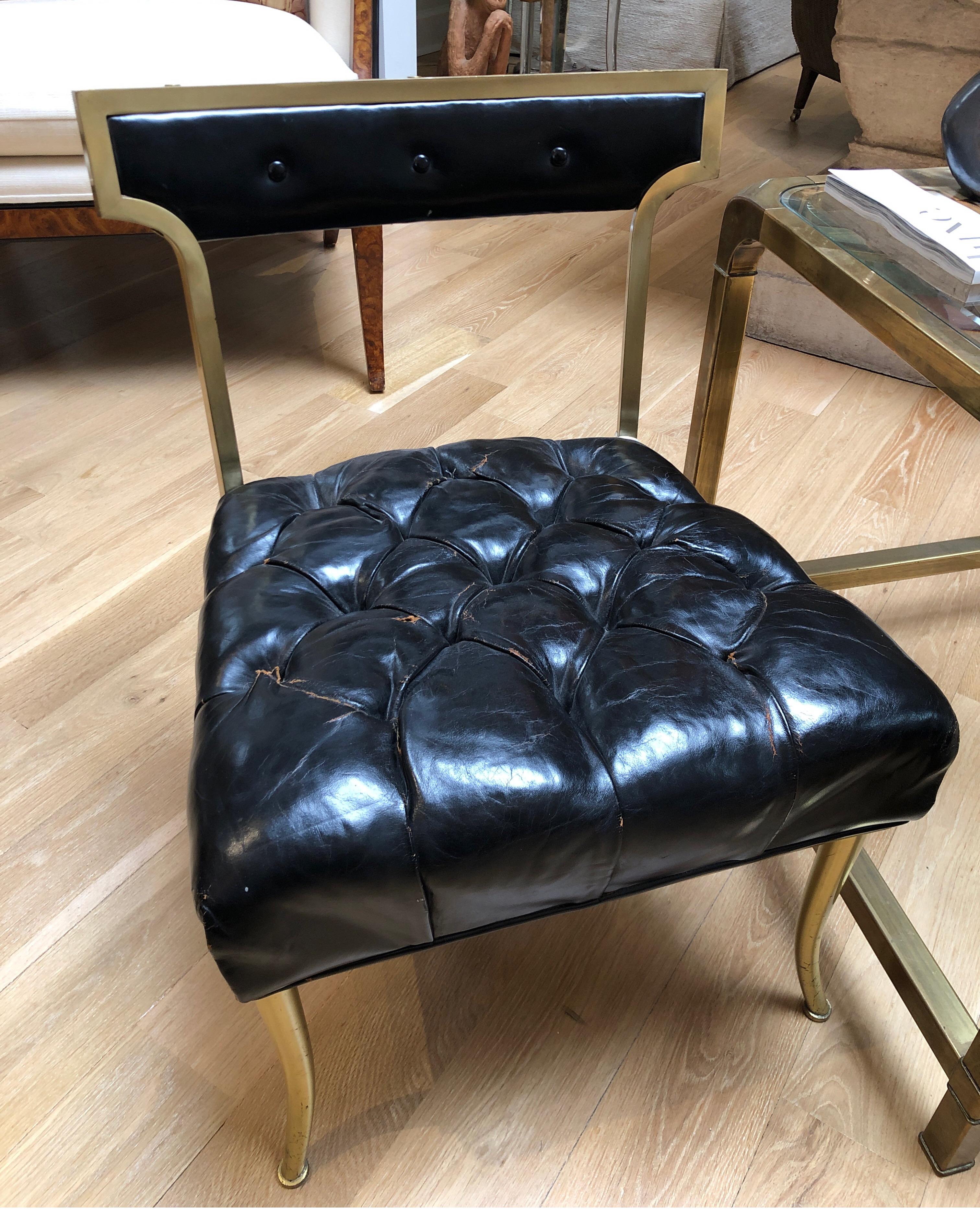 Set of original patent leather Billy Haines slipper chairs. 
Hollywood Regency/Mid-Century modern history. Brass does have some tarnishing and Leather is all original. One chair in overall good condition. One chair has a tear showing the original