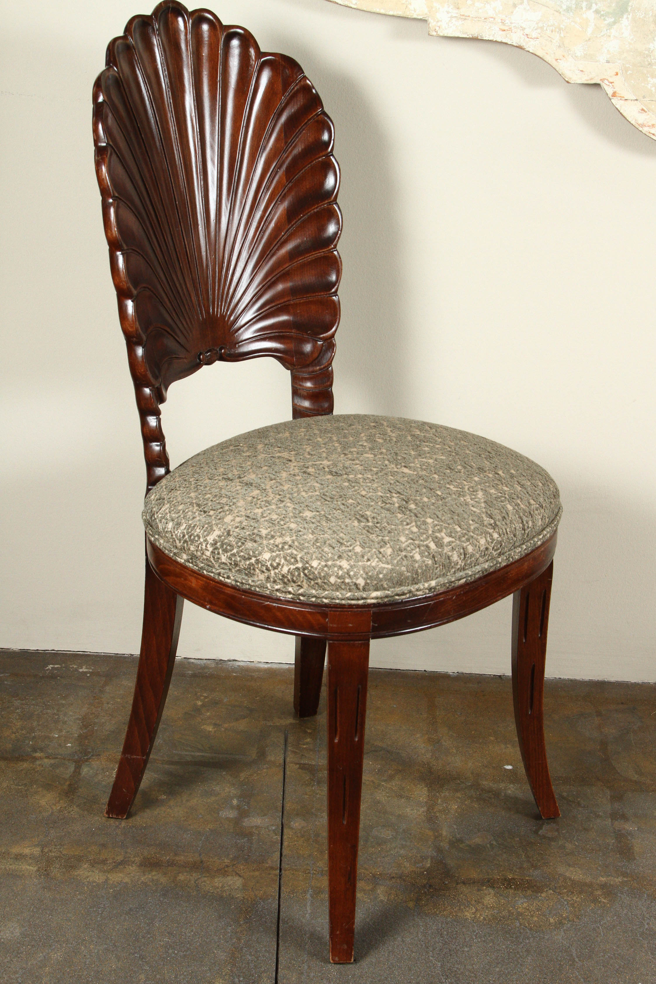 Beautifully carved and detailed chair with shell shaped back. Believed to be Italian from the 1940s or 1950s.