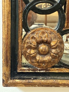Miroir vintage de style néoclassique orné d'anneaux entrelacés, signé Friedman Brothers