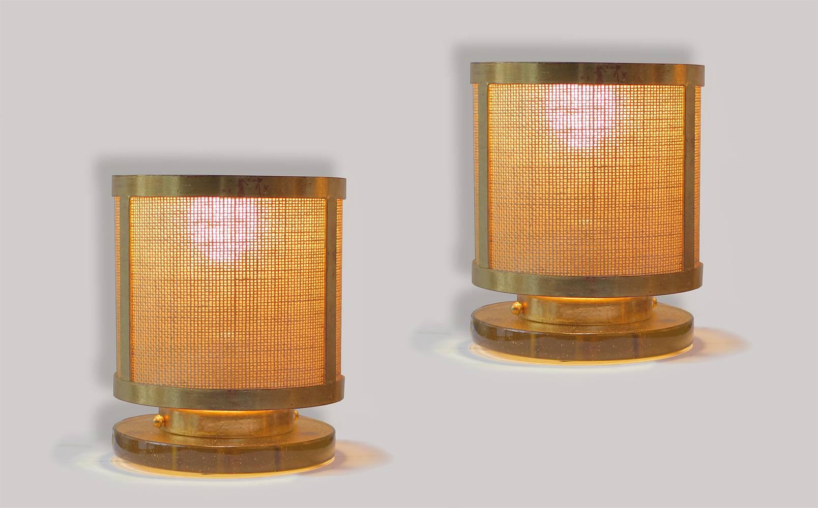 Pair of gilt brass table lamps from a Parisian restaurant, comes from a set of 12.
This pair is the last pair available.
23-karat gold leaf gilding over brass. The shades are in jute burlap, in original condition. Bases are made of amazing yellow