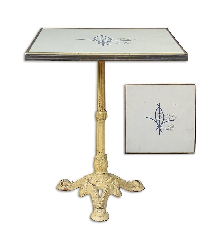 Rare Parisian cafe bistro table from a very popular brasserie in Paris.
The table is accompanied with a brass framed square top stamped 