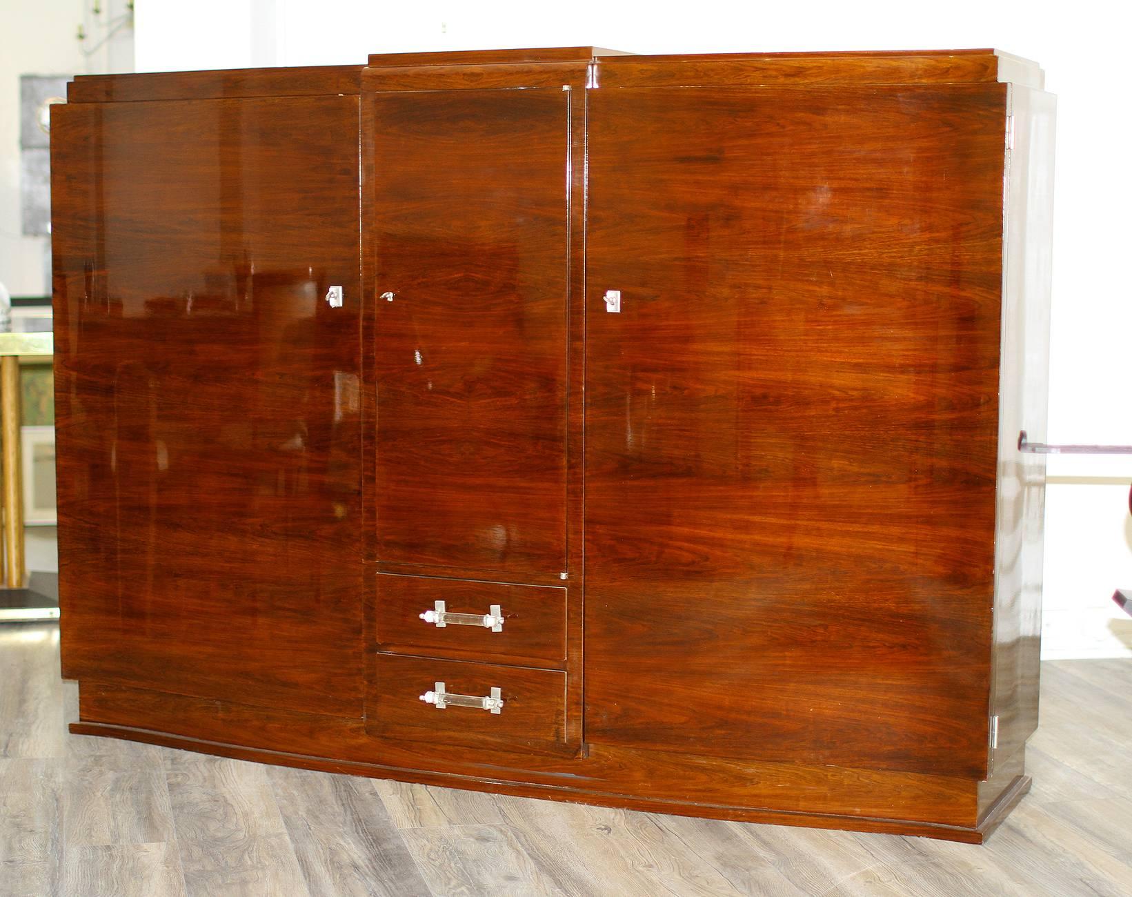 Jules Leleu,
Amazing cabinet in rosewood veneer, France, circa 1930
Three doors and two drawers
Nickel-plated bronze hardware, and handles in glass.
Excellent condition, refinished.
Note: This cabinet is consigned from one of our clients who want to